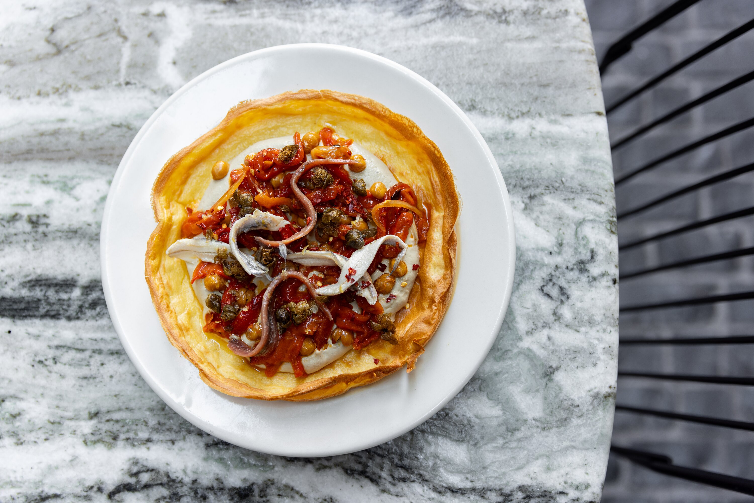 The chickpea farinata on the menu at Kingi restaurant in Britomart. Photo / Babiche Martens