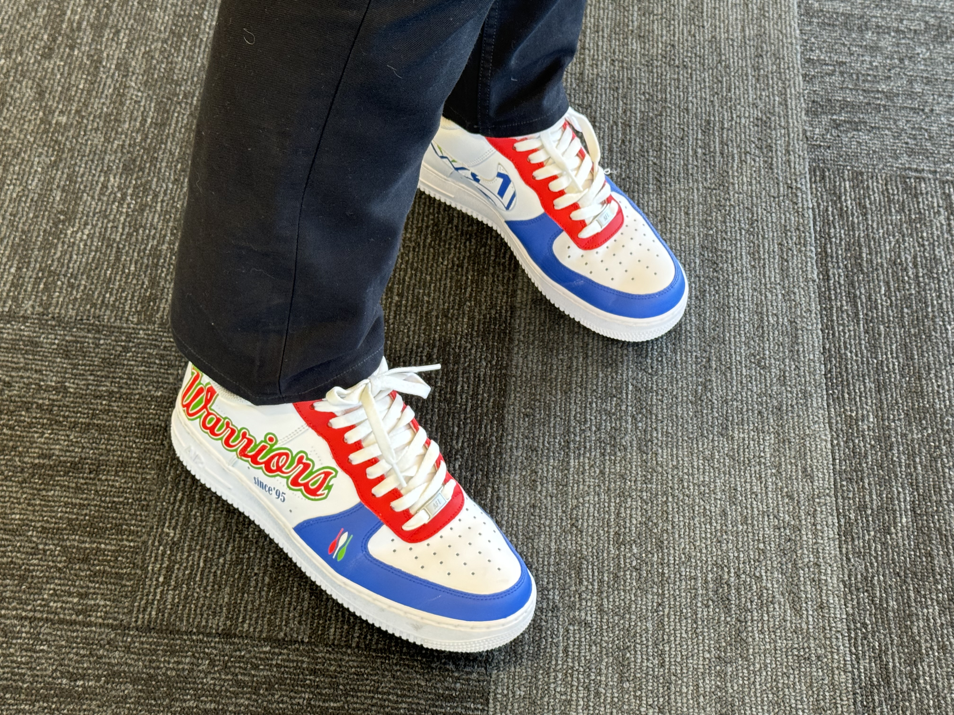 Custom Warriors decals on One NZ CEO Jason Paris's shoes. Photo / Cole Slawson