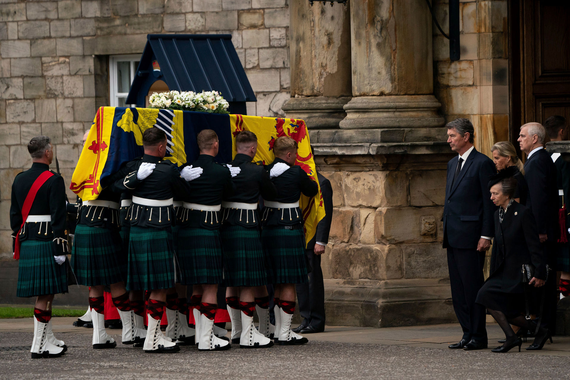 Princess Anne curtsies the coffin of Queen Elizabeth II, draped with the Royal Standard of Scotland, as it arrives at Holyroodhouse, Edinburgh. Photo / Jacob King via AP