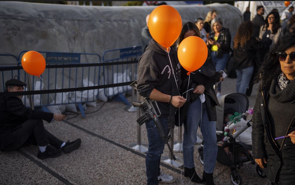 Demonstrators hold orange balloons at a rally in solidarity with Kfir Bibas, an Israeli boy who spent his first birthday in Hamas captivity in the Gaza Strip. Photo / AP
