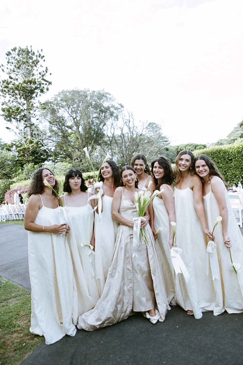The bridesmaids wore custom designs by Olivia Cashmore. Photo / Jonny Scott