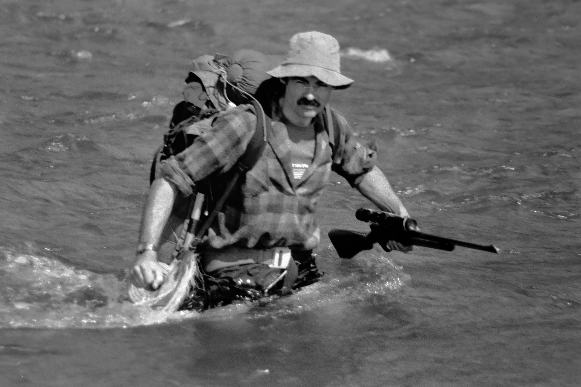 Ian McCrae fording the Mohaka River in the winter of 1983.