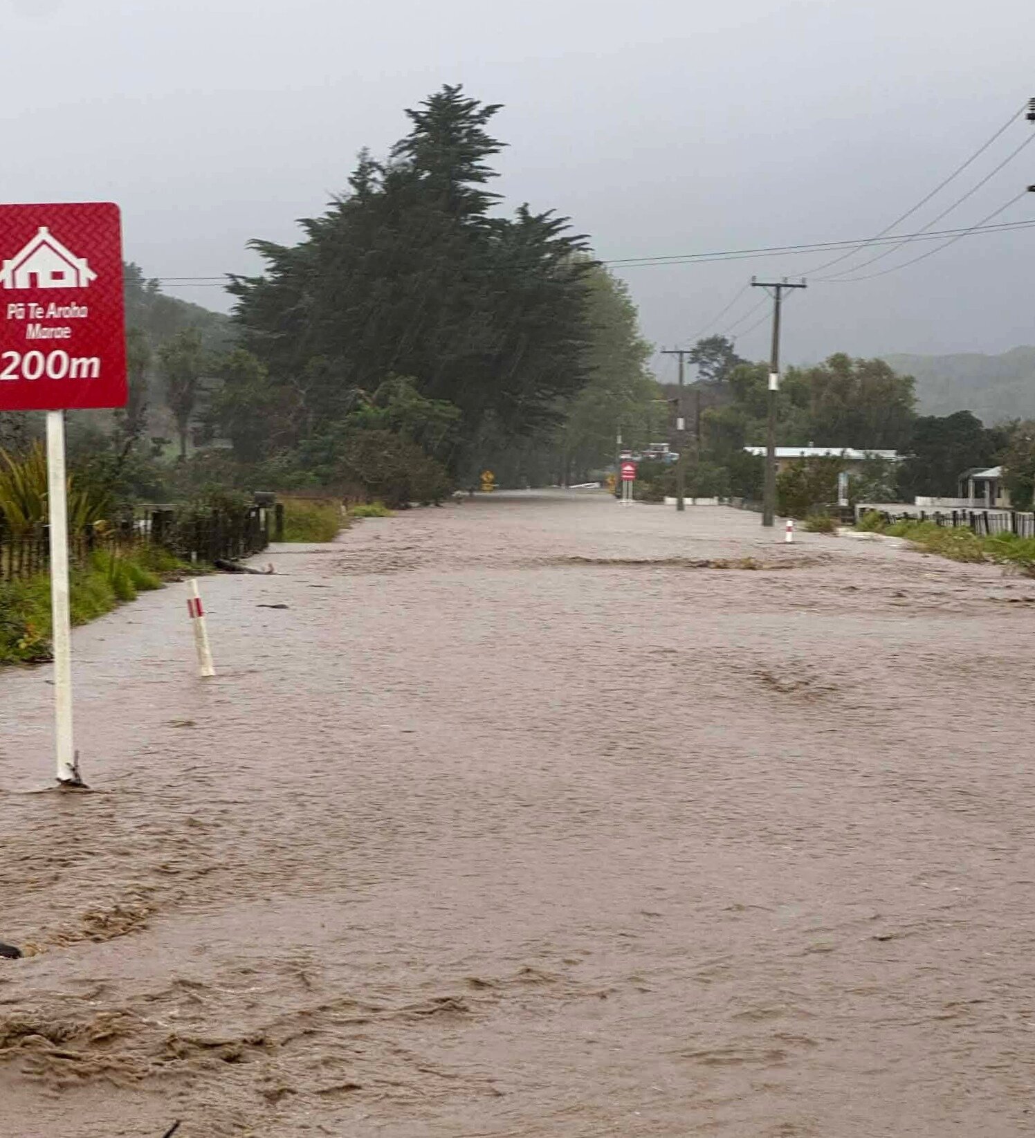Roads turn to rivers in Whirinaki, South Hokianga, after the river burst its banks. Photo / Charles Wikaira