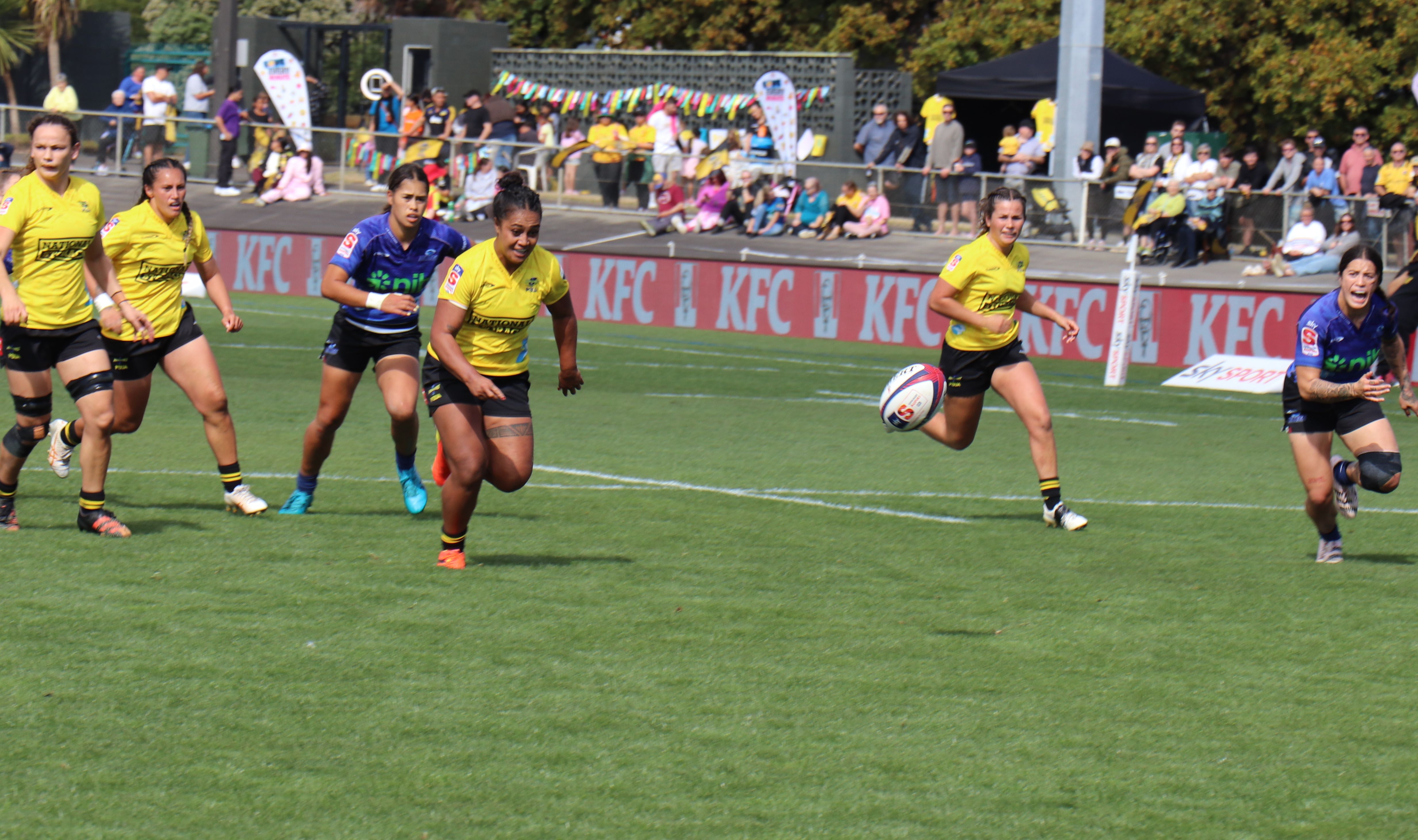 Hurricanes Poua second-five Monica Togoai gets a kind bounce on her was to socring a try against the Blues at Levin Domain. 