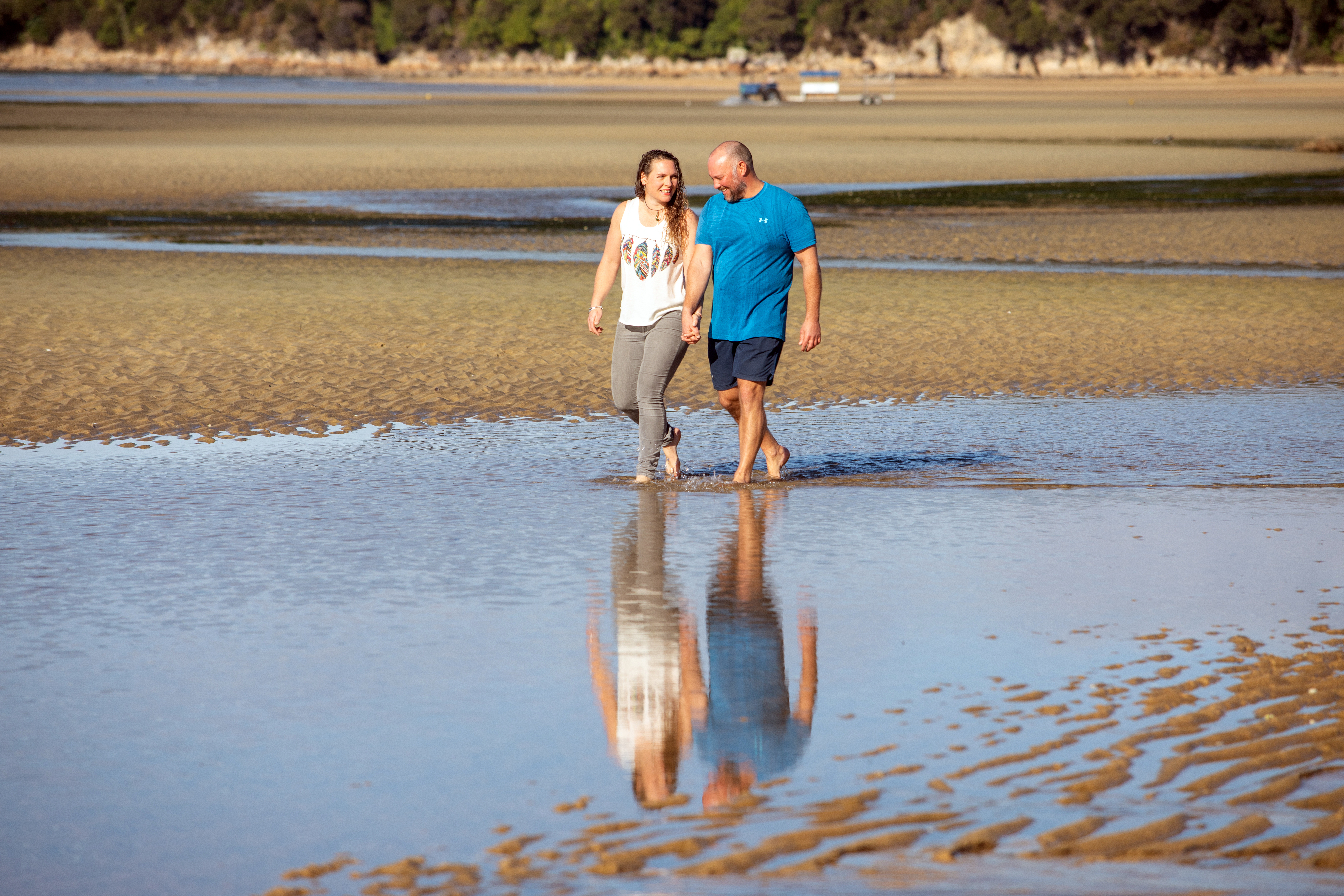 Former NZSAS member Gregg Johnson with partner Nicole Walker walking Tasman Bay's golden sands. Photo / Tim Cuff