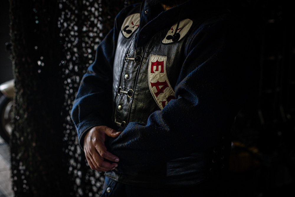 A patched member of the Head Hunters East inside their pad on Wednesday. Photo / Jason Dorday