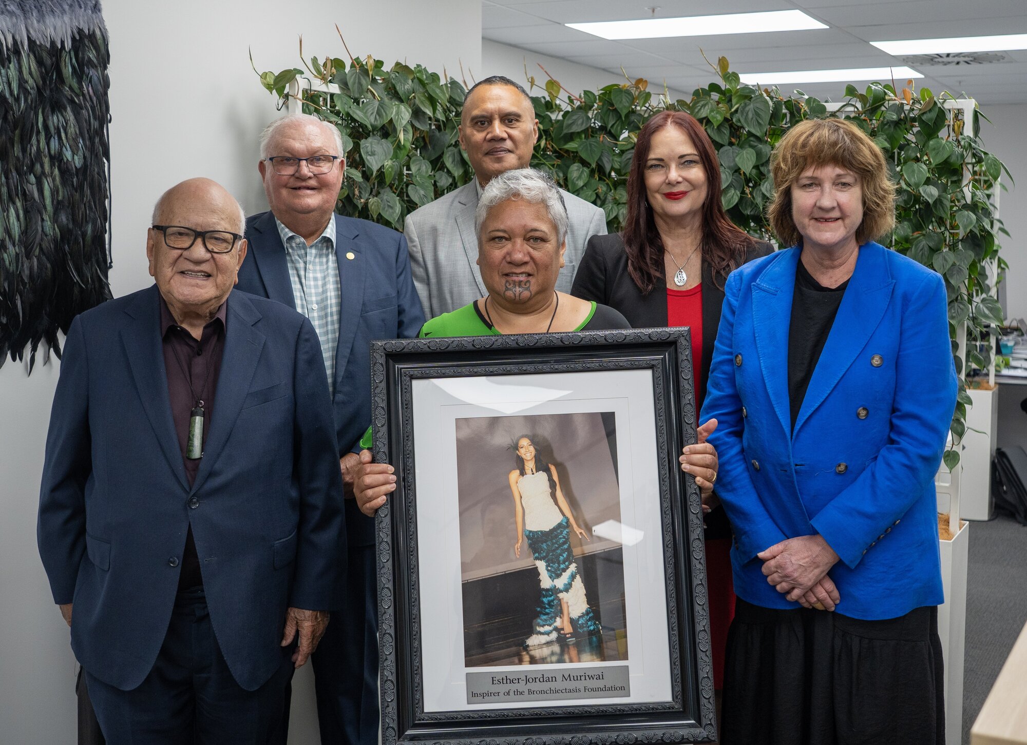 Members of the Asthma and Respiratory Foundation NZ and Bronchiectasis Foundation cheer the new fund in honour of Esther-Jordan Muriwai including (from left) Sir John Clarke, John Knight, Camron Muriwai, Ana Sadlier (with photo), Letitia Harding and Professor Cass Byrnes.