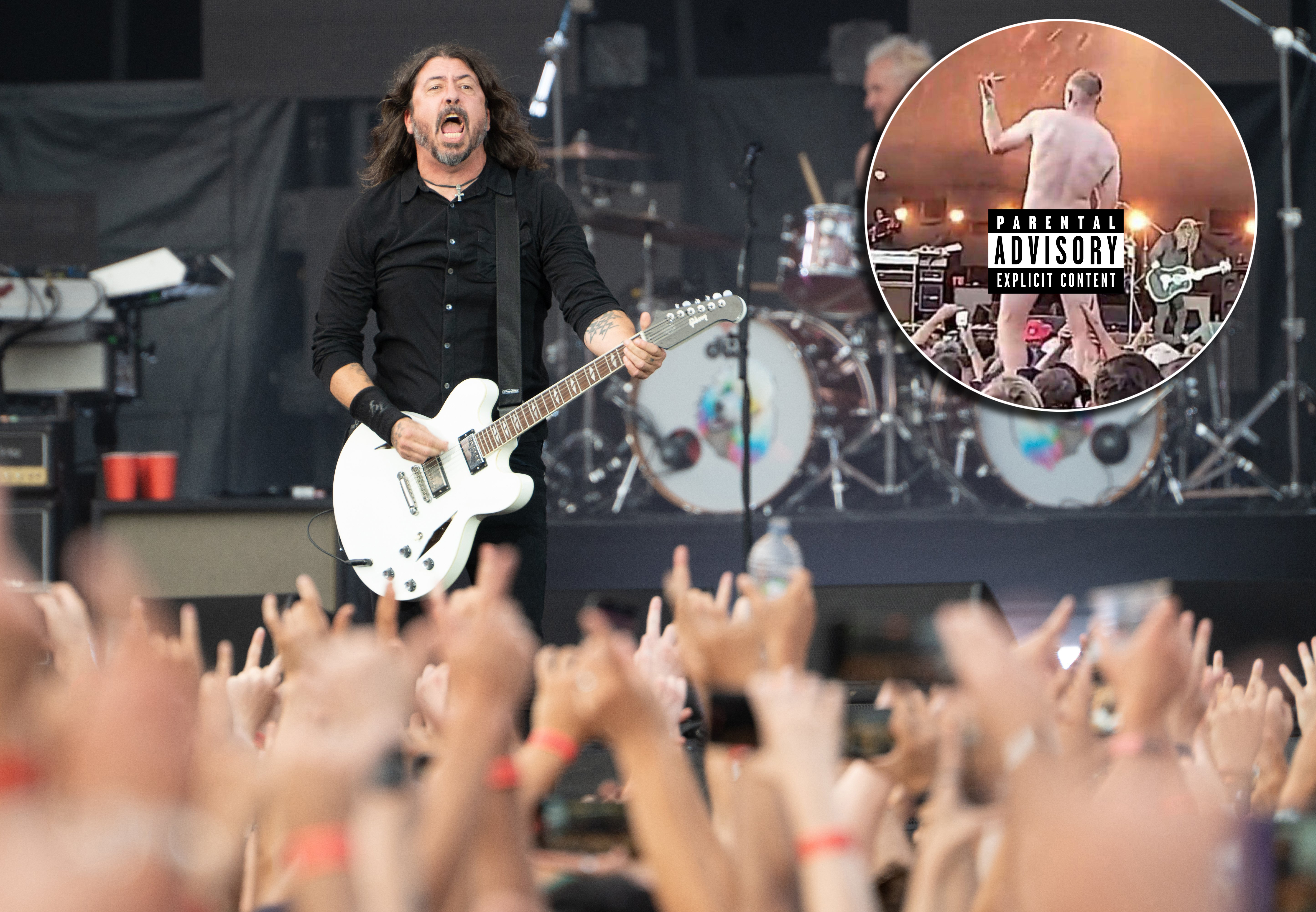As the Foo Fighters performed in Christchurch, a man stripped fully nude.