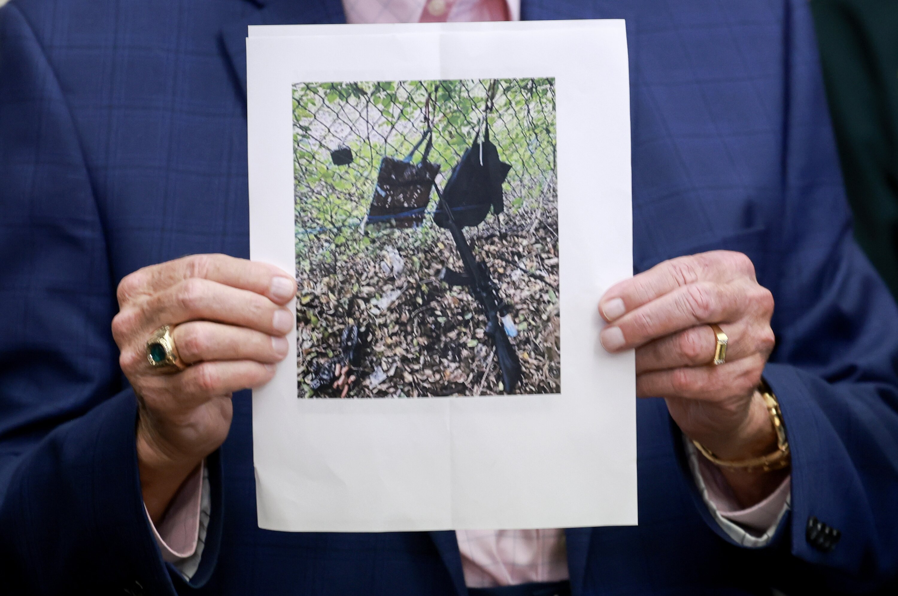 Palm Beach County Sheriff Ric Bradshaw holds a photograph of the rifle and other items found following an apparent assassination attempt of former US President Donald Trump. Photo / Getty Images