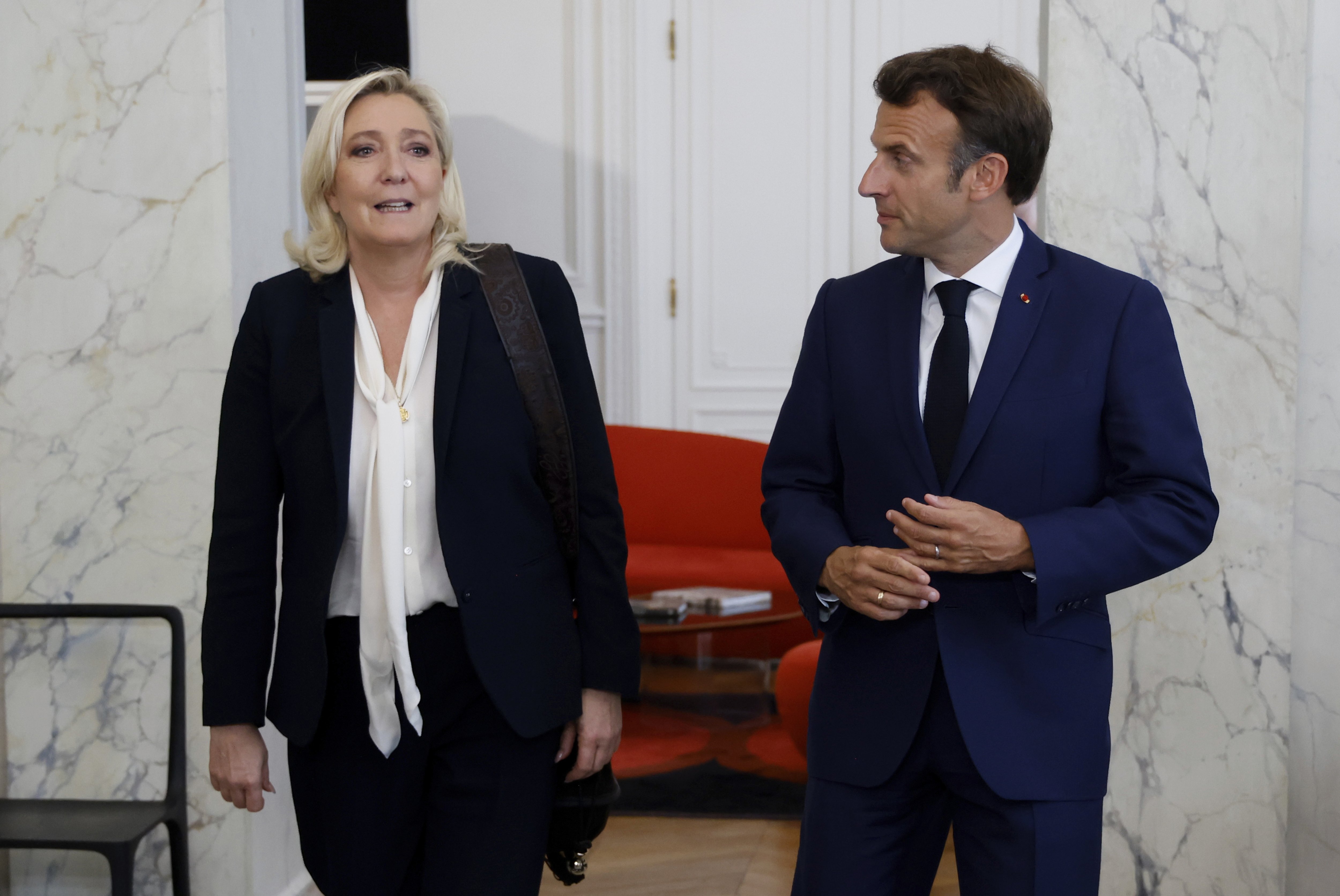 French far-right Rassemblement National (National Rally) leader Marine Le Pen (left) and French President Emmanuel Macron (right). Photo / AP