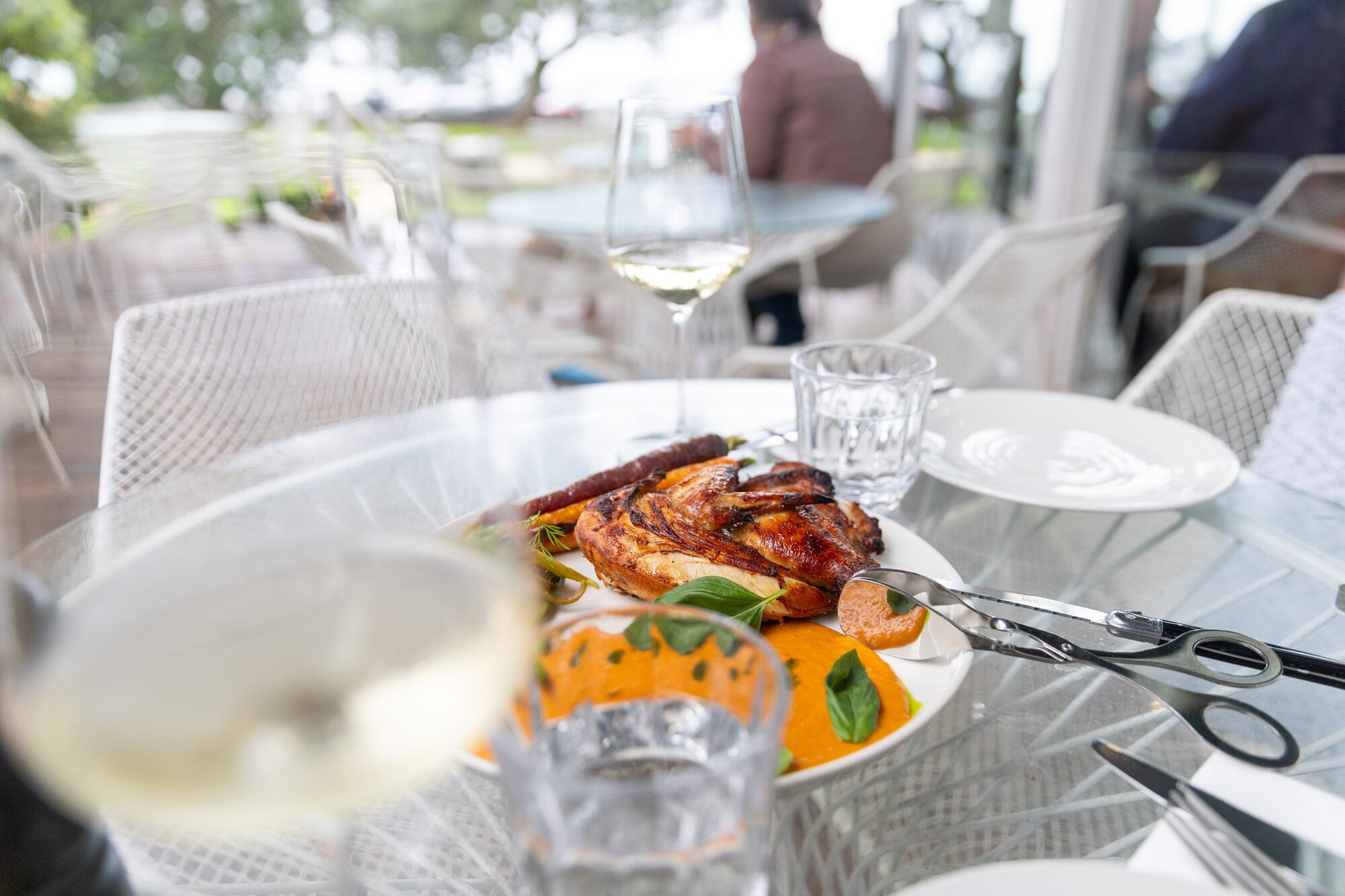 Takapuna Beach Cafe's half-roasted chicken, prepared over two days and served with a spiced jus. Photo / Michael Craig