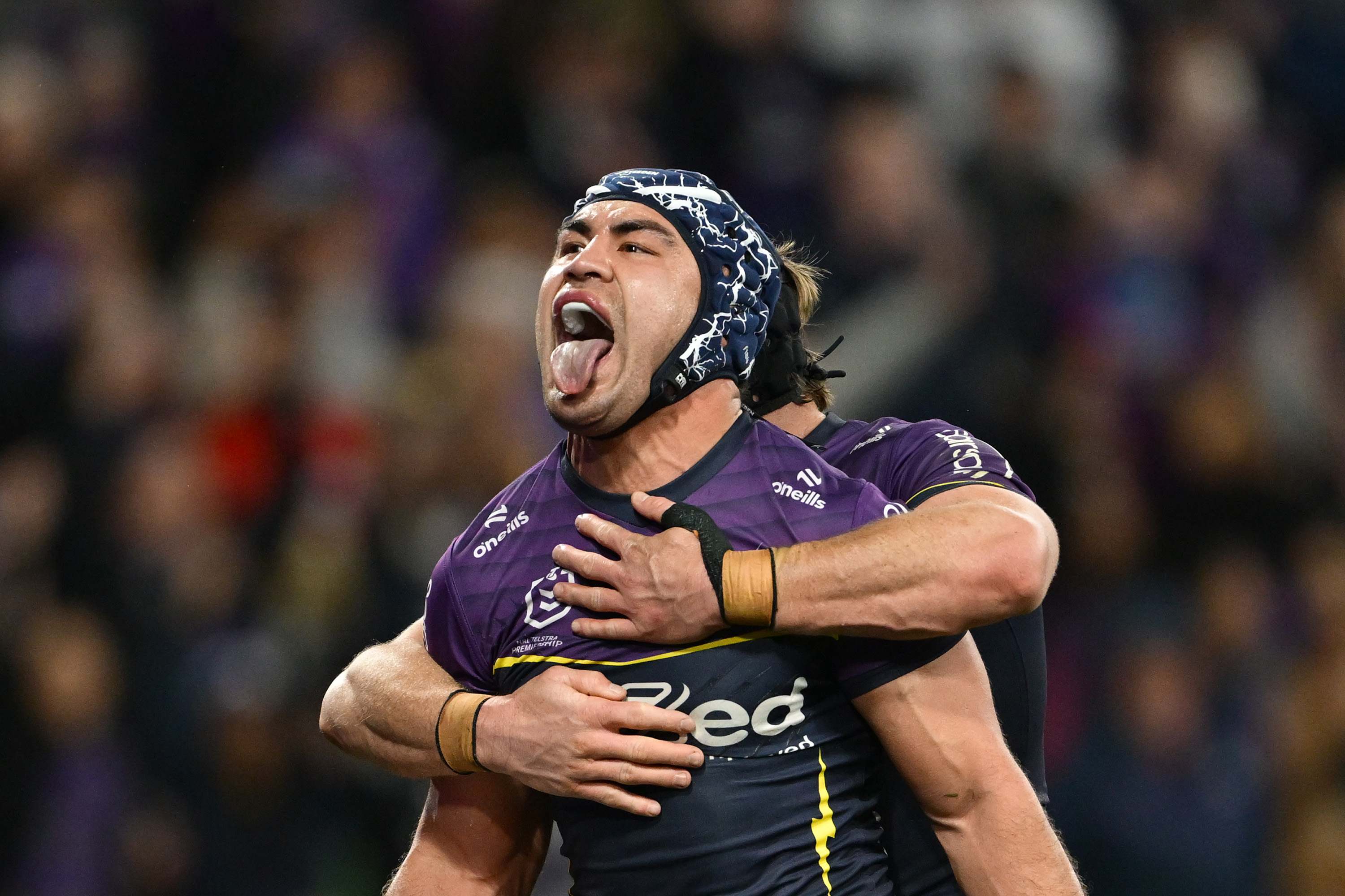 Jahrome Hughes of the Storm celebrates scoring a try. Photo / Getty Images