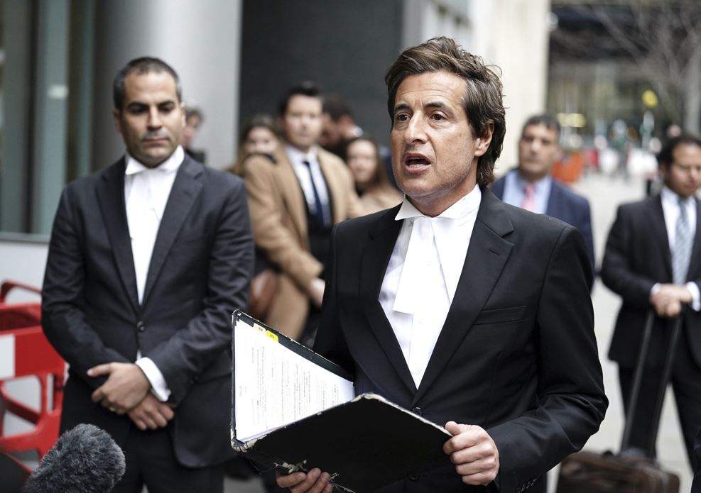 Lawyer Barrister David Sherborne reads a statement on behalf of Britain's Prince Harry after he was awarded £140,600 after bringing a phone hacking claim against Mirror Group Newspapers (MGN), outside the Rolls Buildings in central London, Friday Dec. 15, 2023. (Jordan Pettitt/PA via AP)