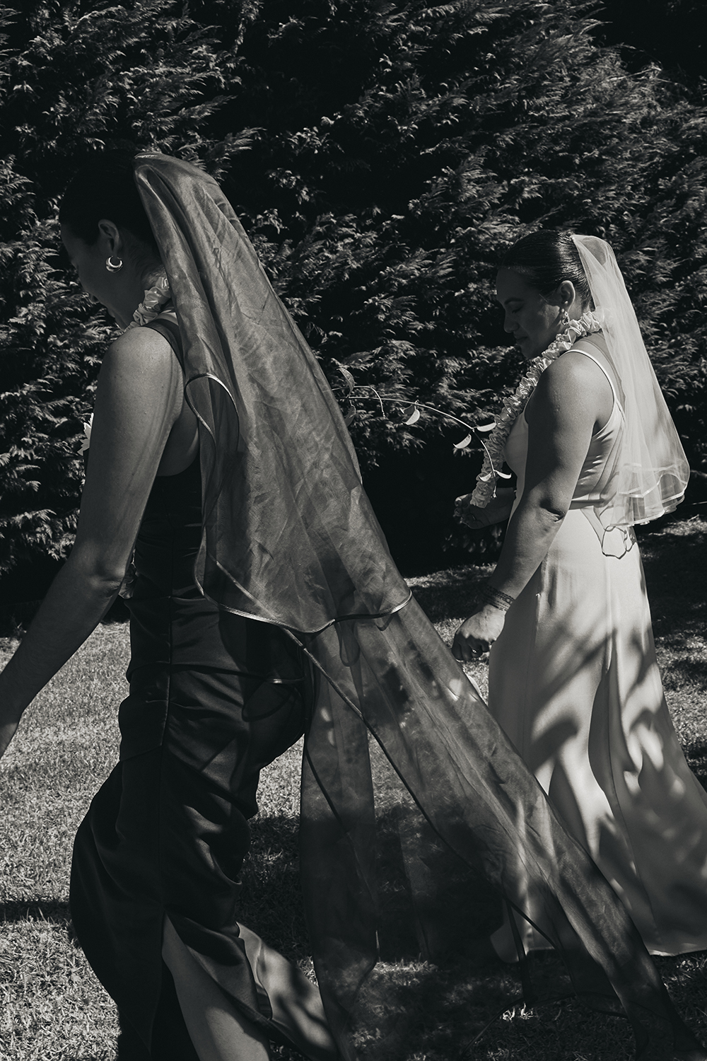 Both brides wore looks by local designers; Keva had a custom Paris Georgia dress and sewed her own veil, while Deirdre’s dress was by Dominique Healy. Photo / Apela Bell