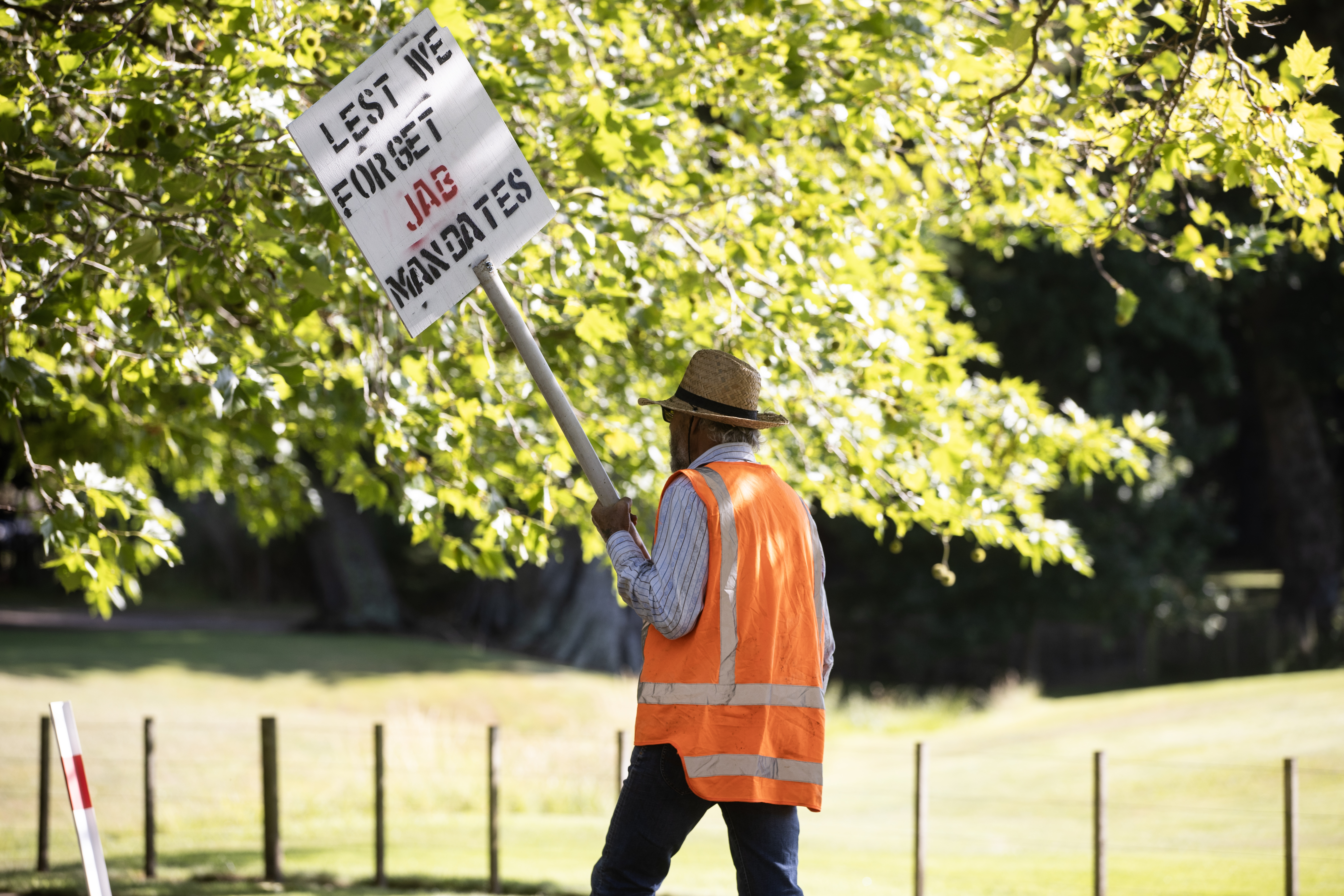 A lone protester near the wedding venue shortly after 9am. Photo / George Heard