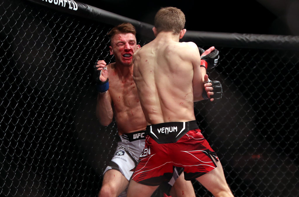 Arnold Allen strikes Dan Hooker in the Featherweight bout at The O2, London. Photo / Getty