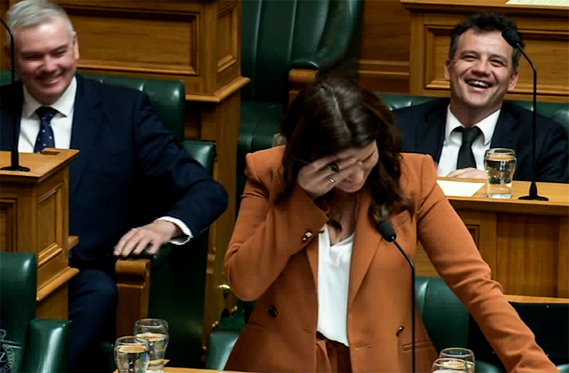 National MP Nicola Willis laughs in Parliament after asking Grant Robertson the 