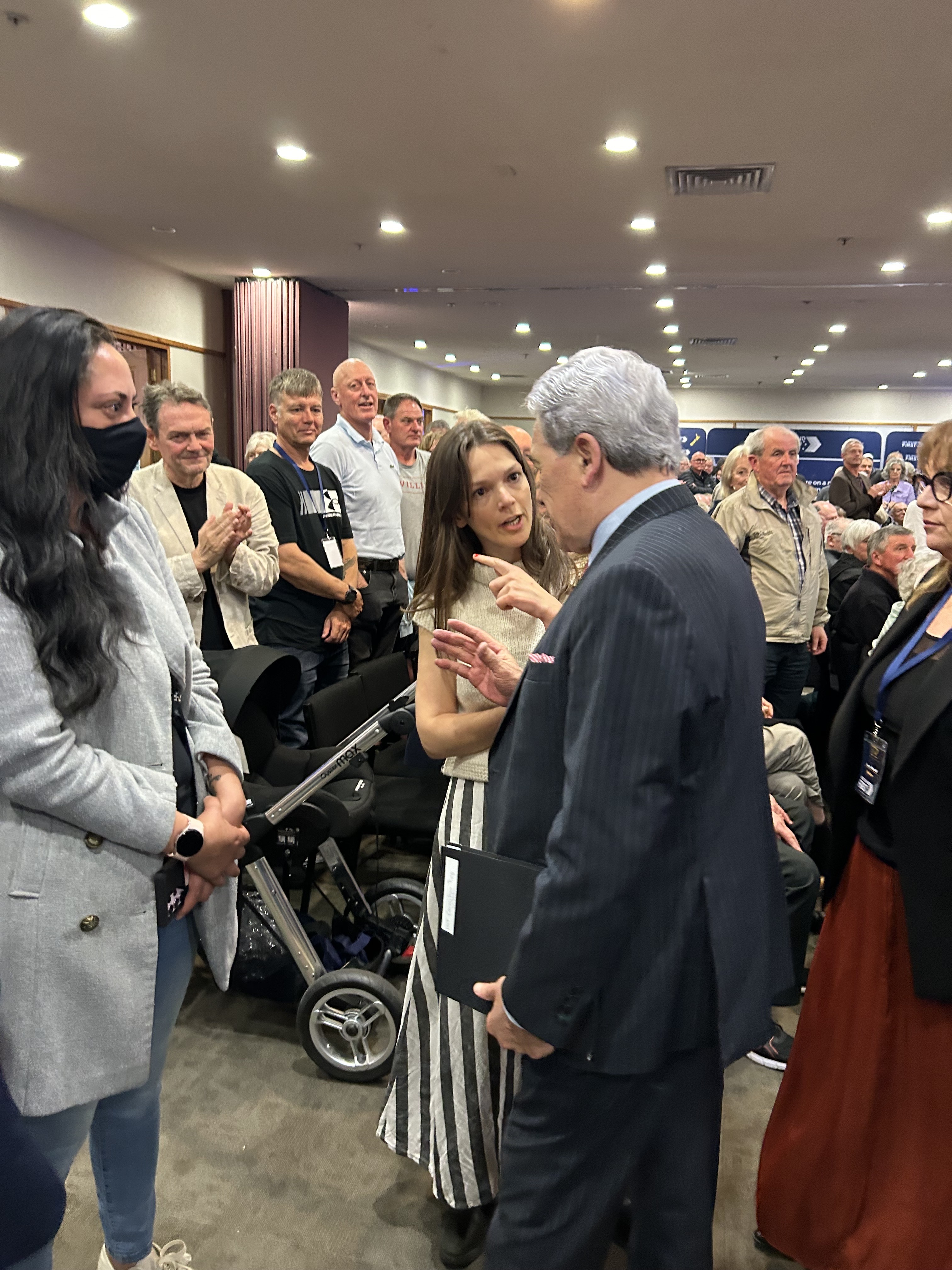 NZ First leader Winston Peters tries to shrug off a pro-Palestine protester after his speech at a public meeting in Hamilton to finish his party's conference. Photo / Adam Pearse