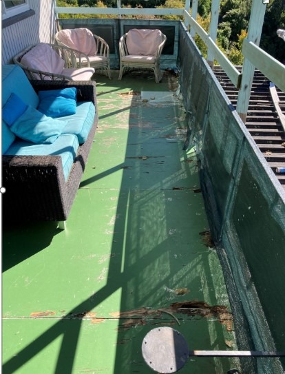 Rotting flooring on the deck.