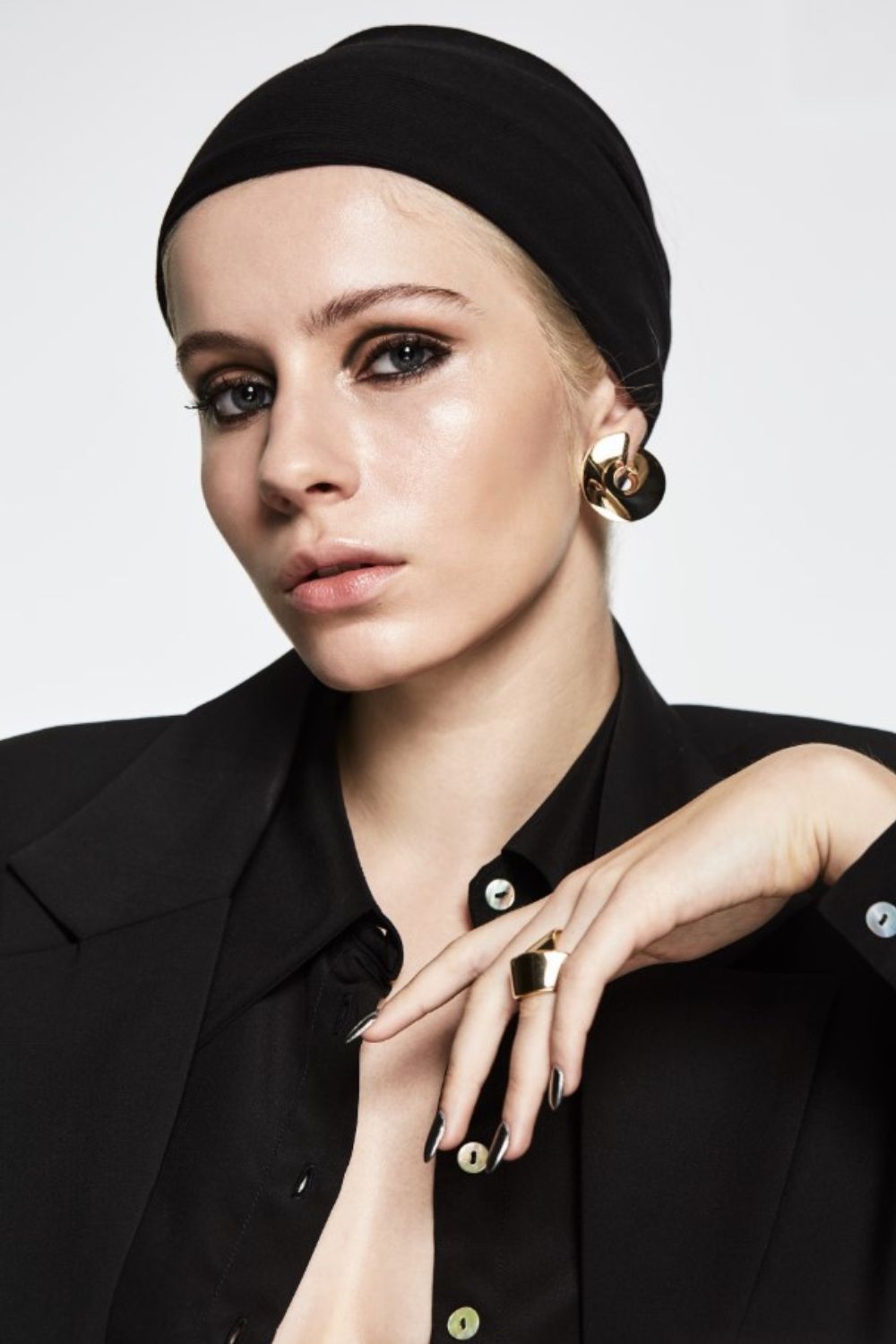 Chloe wears Twenty-Seven Names Shirt, earrings and ring by Partridge Jewellers. Photo / Carolyn Haslett