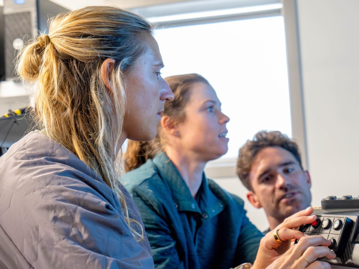 New Team NZ crewmates Molly Meech (left) and Erica Dawson learn the buttons to trim an AC40 ahead of the first Women's America's Cup. Photo / ETNZ