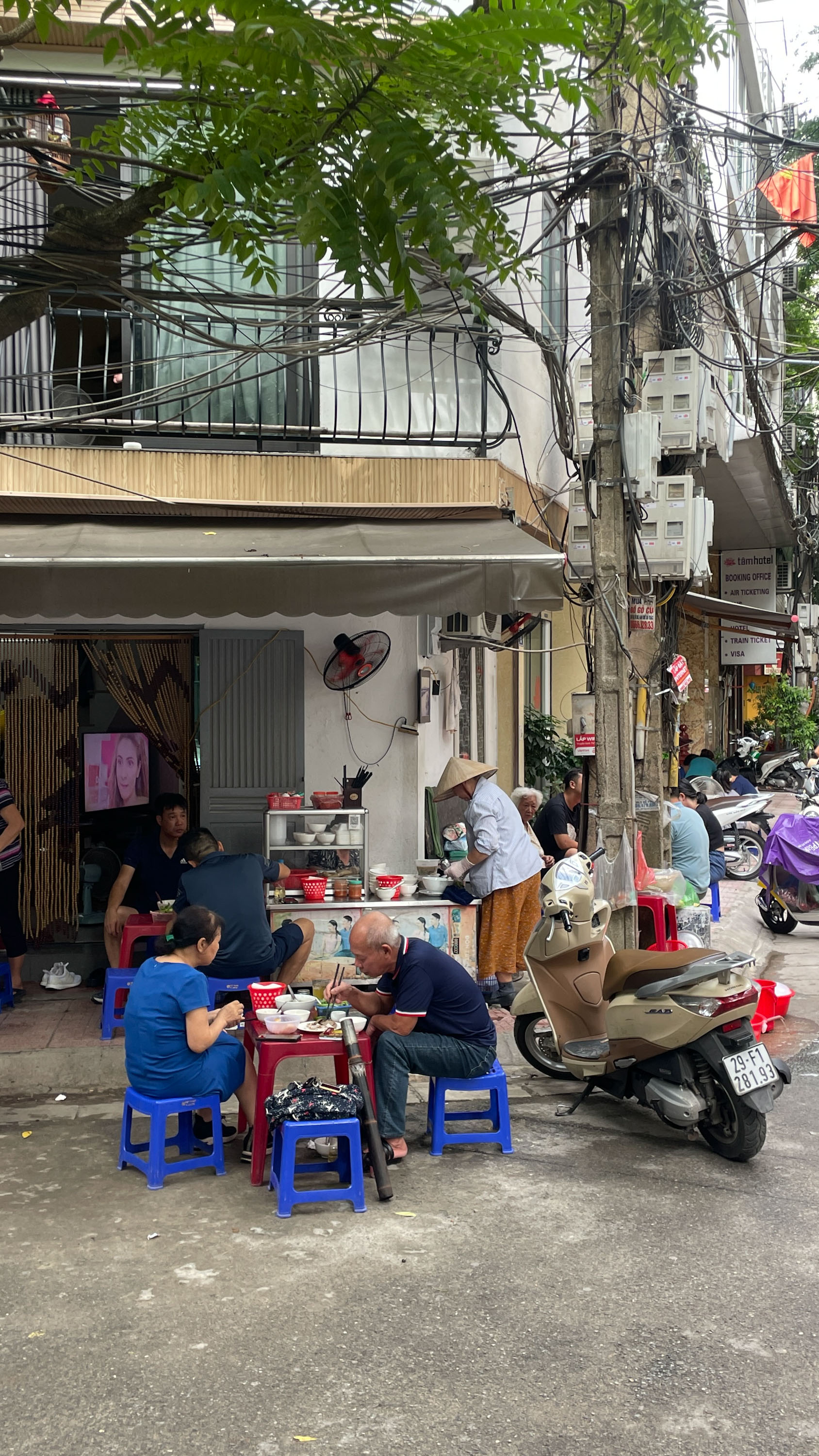 Locals huddled over bowls of pho. Photo / India Hendrikse