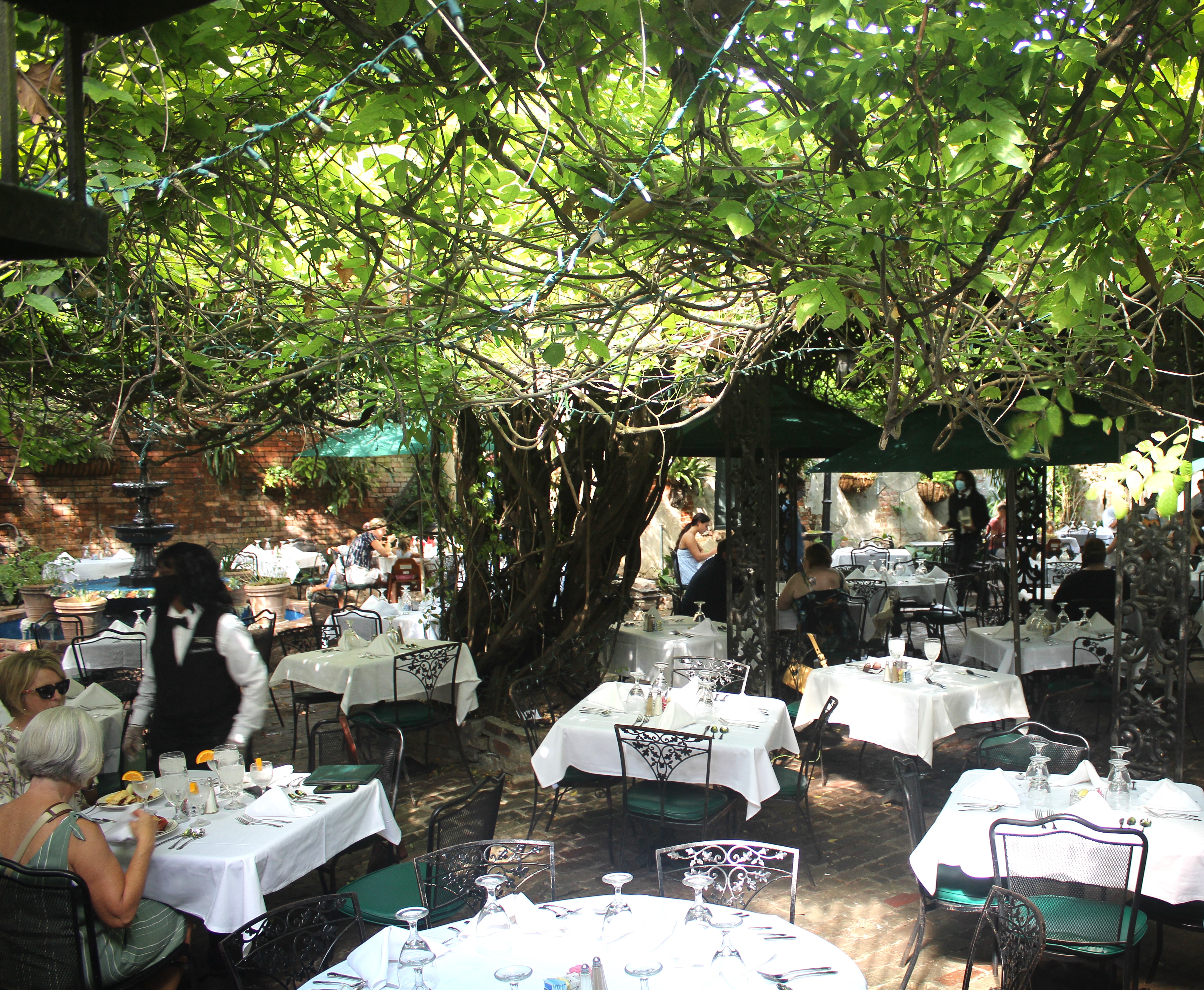 The Court of Two Sisters boasts the largest dining courtyard in the French Quarter. Photo / Supplied; The Court of Two Sisters