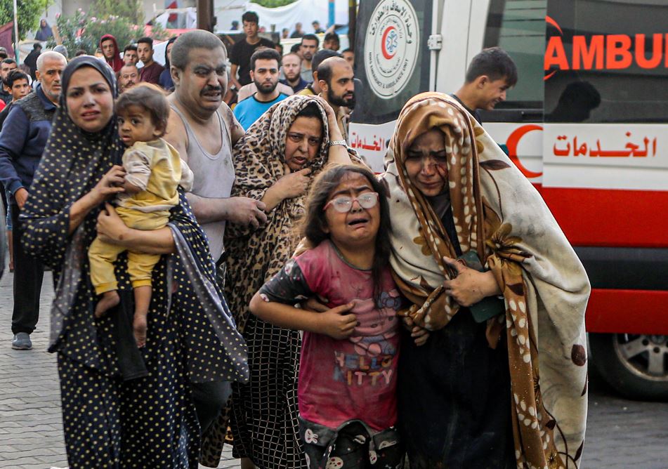 Wounded Palestinians arrive to al-Shifa hospital, following Israeli airstrikes on Gaza City. Photo / AP