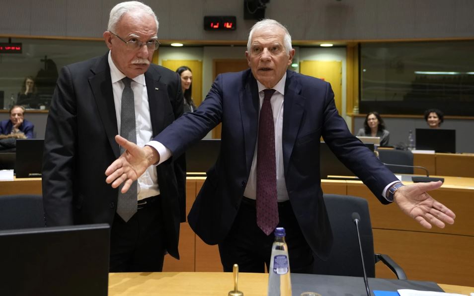 Palestinian Foreign Minister Riyad Najeeb al-Maliki (left) speaks with European Union foreign policy chief Josep Borrell during a meeting of EU foreign ministers. Photo / AP