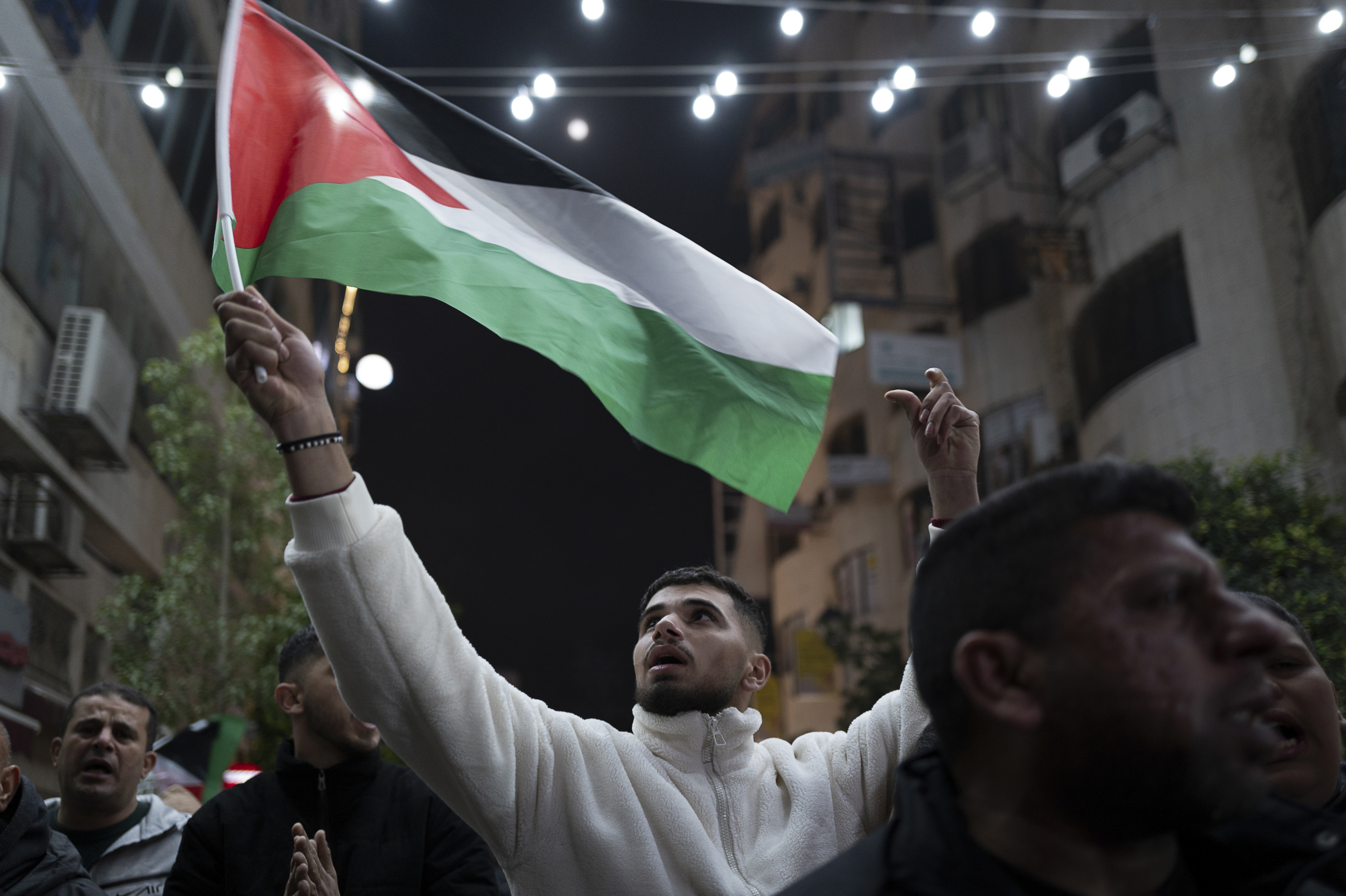 Celebrations of the annoucement of a cease-fire in Ramallah, West Bank. Photo / Afif Amireh, The New York Times