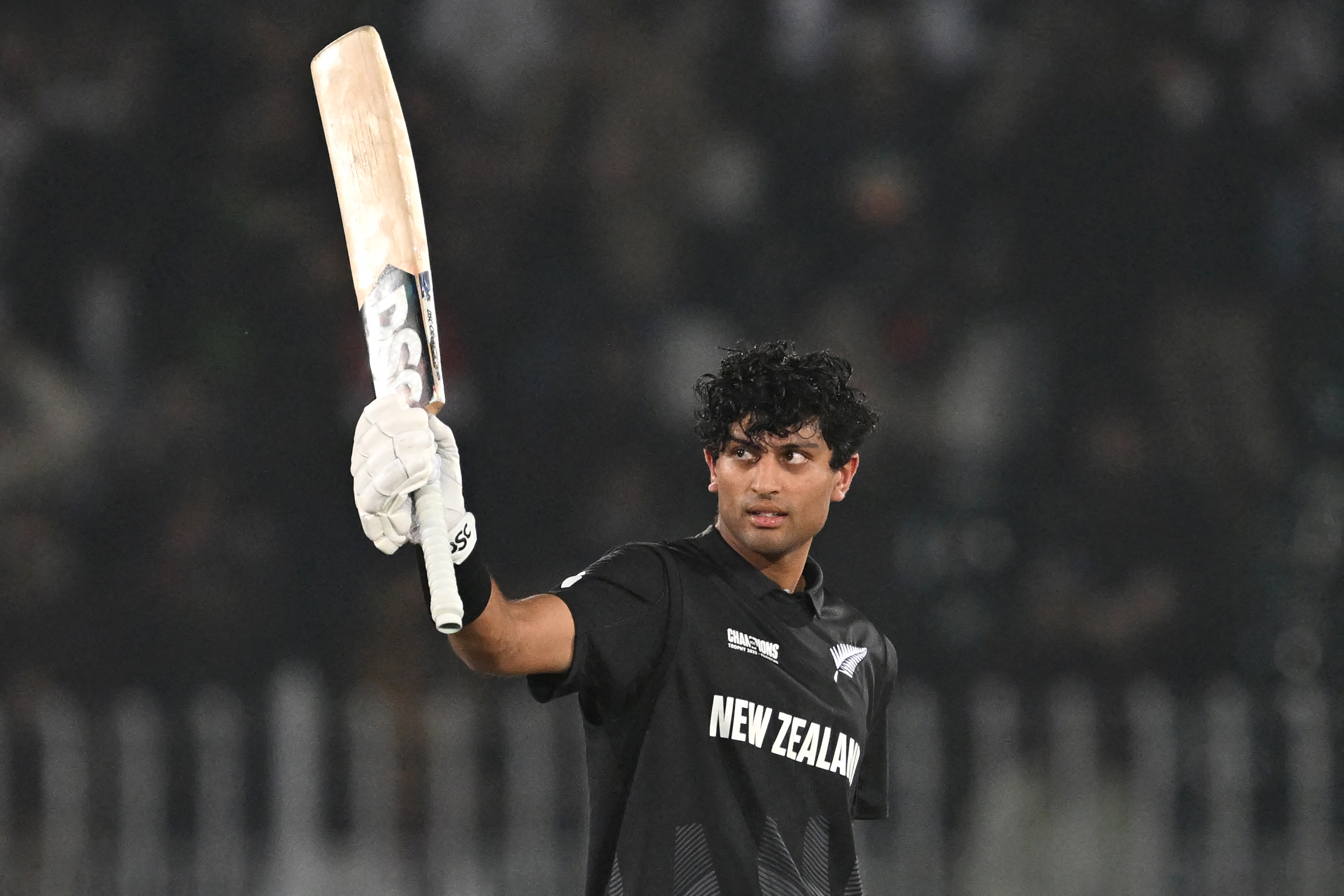 New Zealand's Rachin Ravindra celebrates after scoring a century during the ICC Champions Trophy victory over Bangladesh. Photo / AFP