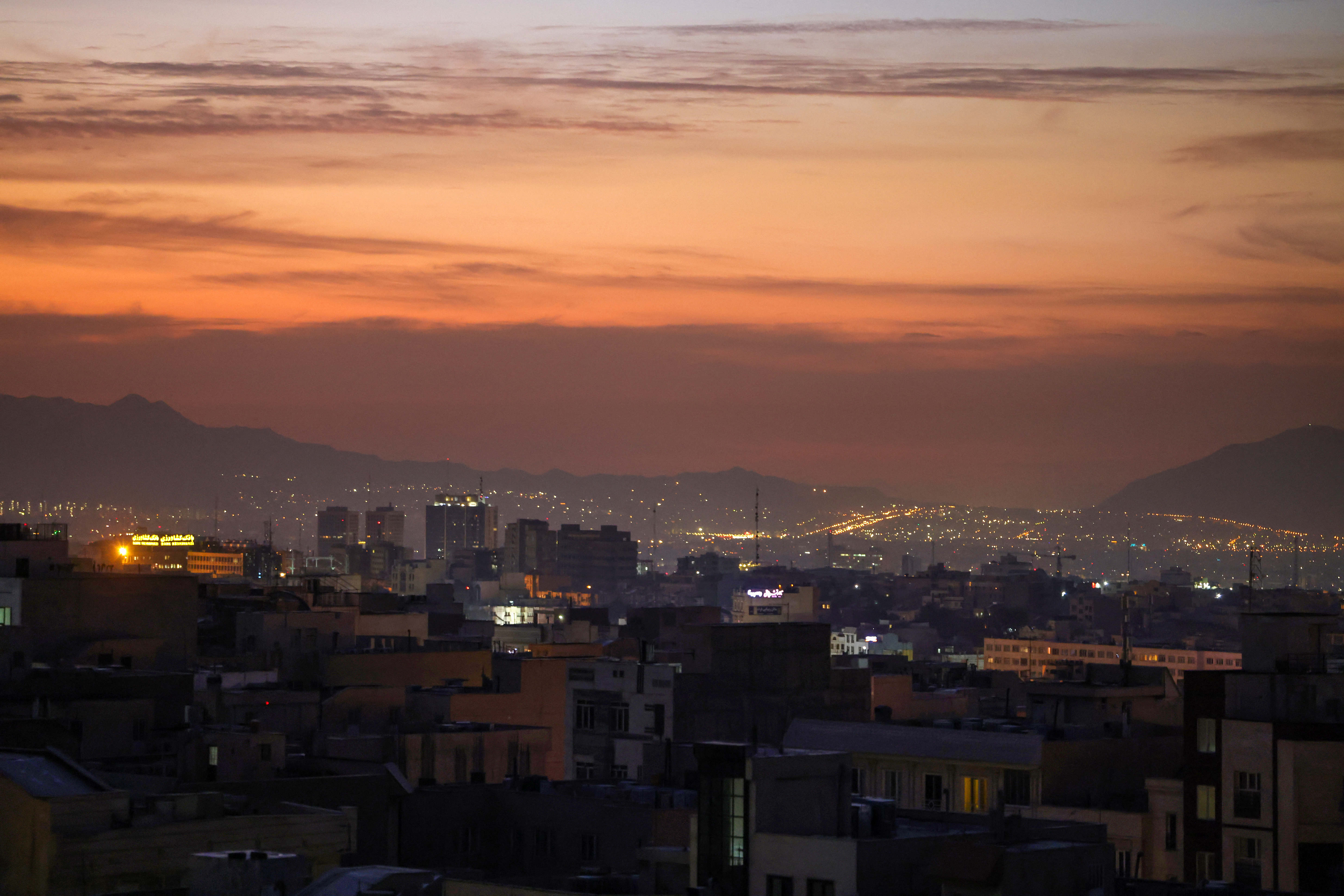 Part of the city skyline is pictured at dawn after several explosions were heard in Tehran as Israel announced the launch of