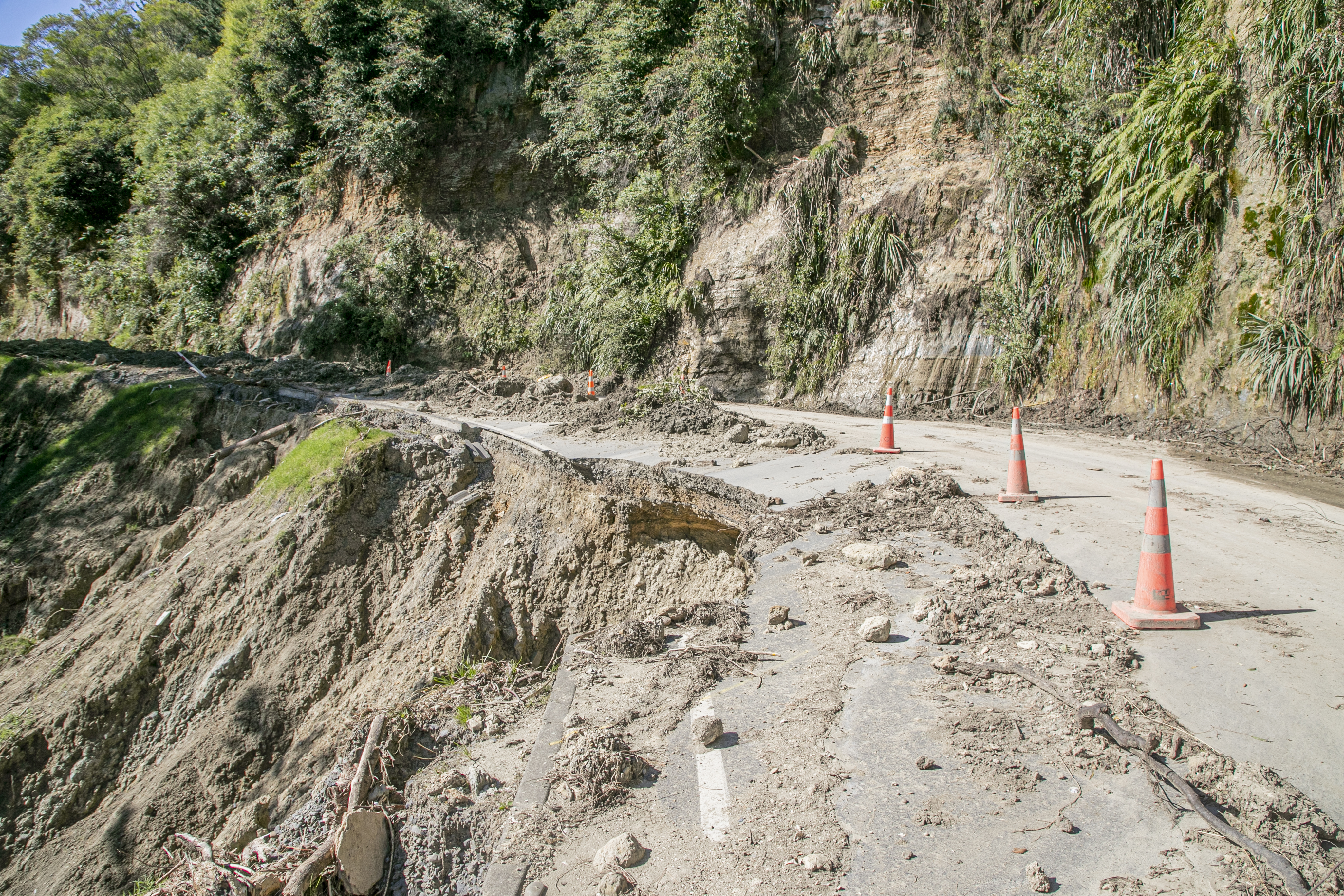 A major dropout on State Highway 2 between Napier and Waikare was one of more than 100 sites of slips, washouts and other damage caused by Cyclone Gabrielle in February. Photo / NZME