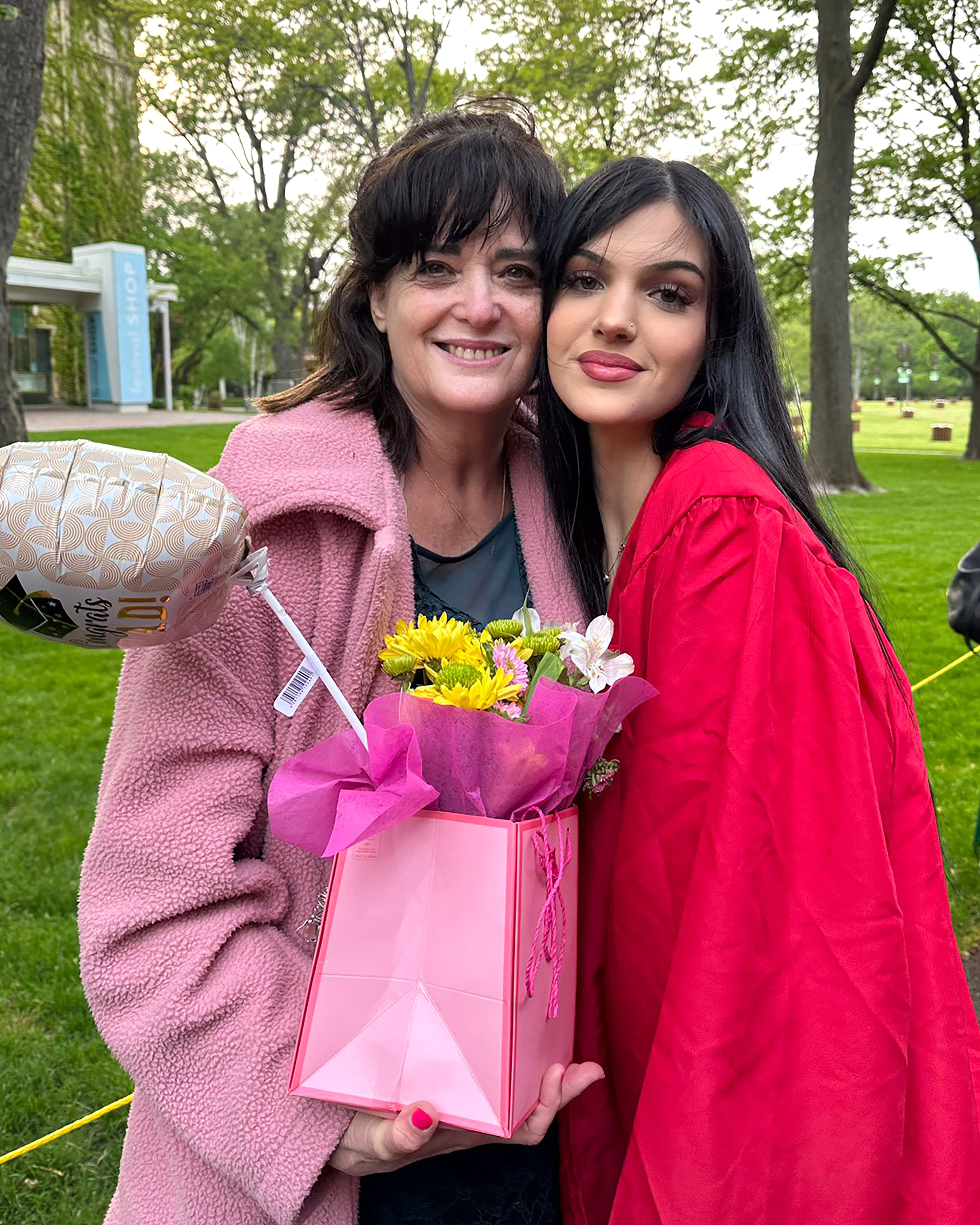 In this undated photo provided by Rabbi Meir Hecht on behalf of the Raanan family, Judith Raanan (left) and her daughter Natalie, 18, are pictured after Natalie's recent high school graduation. Judith and Natalie went missing while visiting relatives in Nahal Oz for Simchat Torah, a festive Jewish holiday that marks the conclusion of the annual reading of the Torah. Photo / Raanan Family via AP