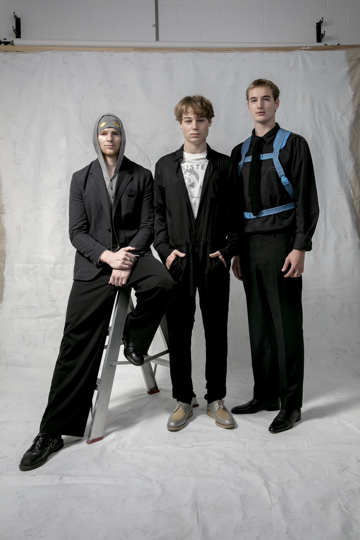 Left to right: Ike wears jumper from Black Swan autumn/winter 2009 and blazer from Royally Screwed spring/summer 2009; Cosmo wears boiler suit from Black Swan autumn/winter 2009 and Sister T-shirt; Tom wears Royally Screwed shirt spring/summer 2009 and Take a Hike backpack, spring/summer 2010. Photo / Babiche Martens