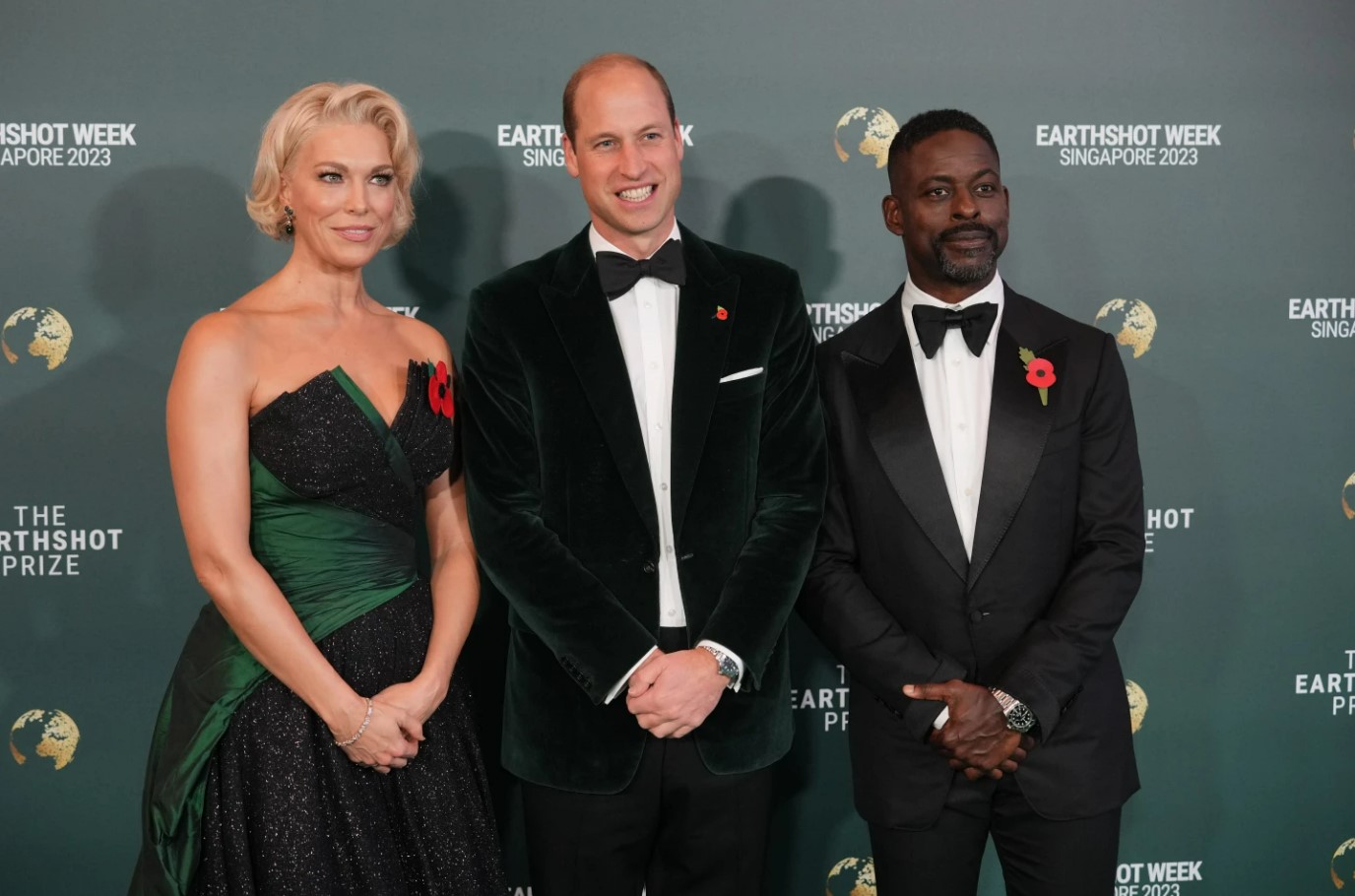 Hannah Waddingham (from left), Prince William and Sterling K. Brown pose on the green carpet for the 2023 Earthshot Prize awards in Singapore. Photo / AP