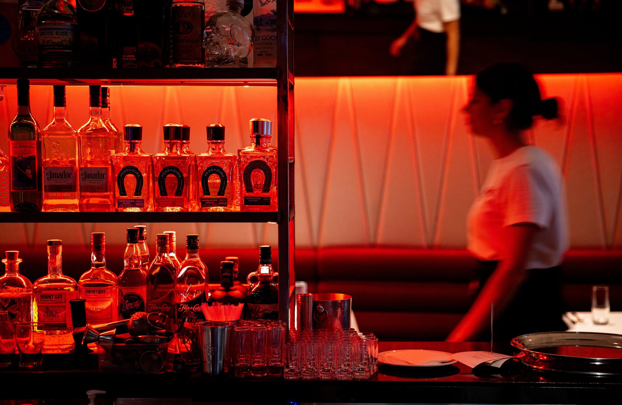 The neon sidelight from Gigi's main bar casts a pink filter over your face and food. Photo / Dean Purcell