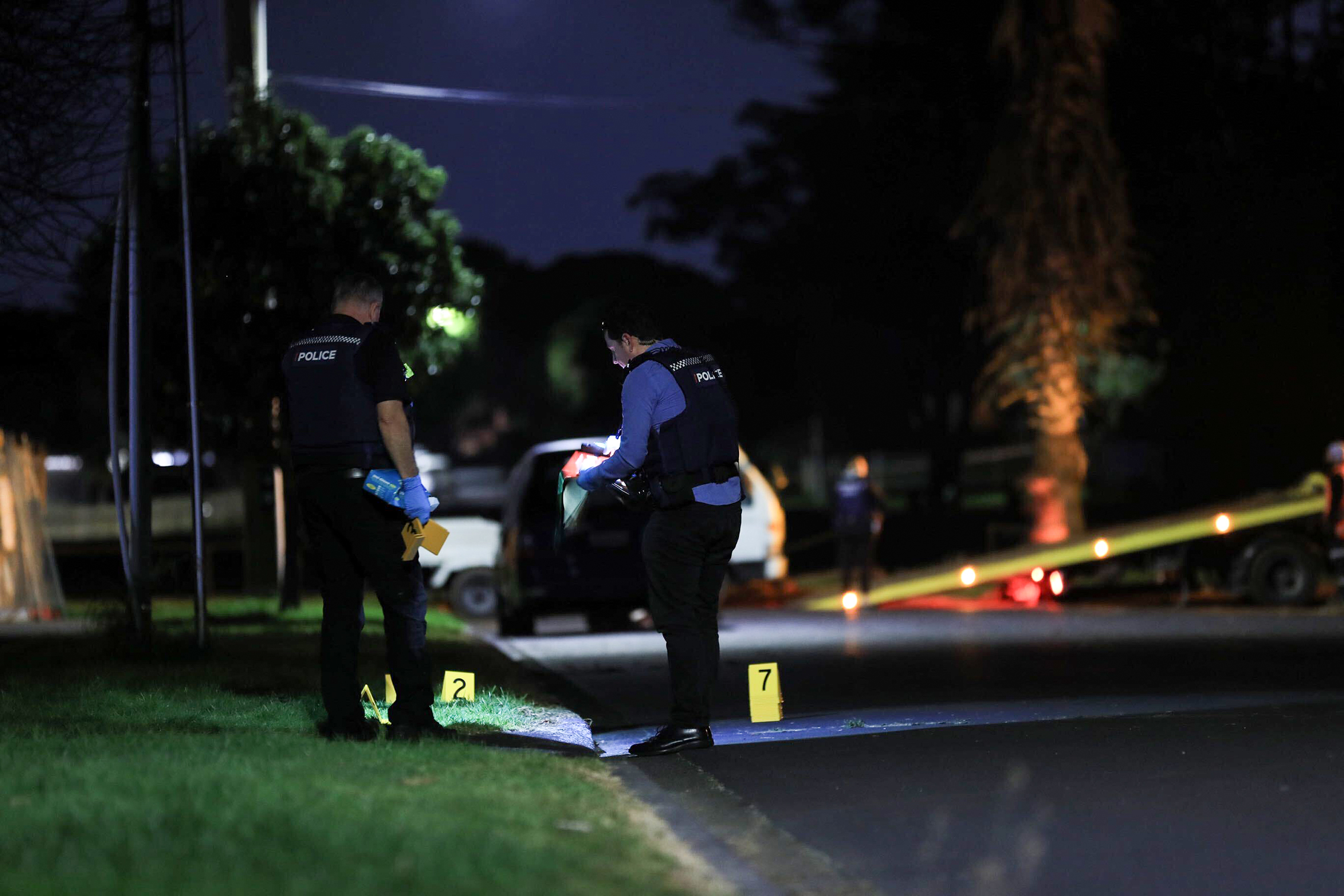 Police investigate the scene at Taurima Reserve where Charles Pongi was shot and fatally wounded in broad daylight. Photo / Hayden Woodward