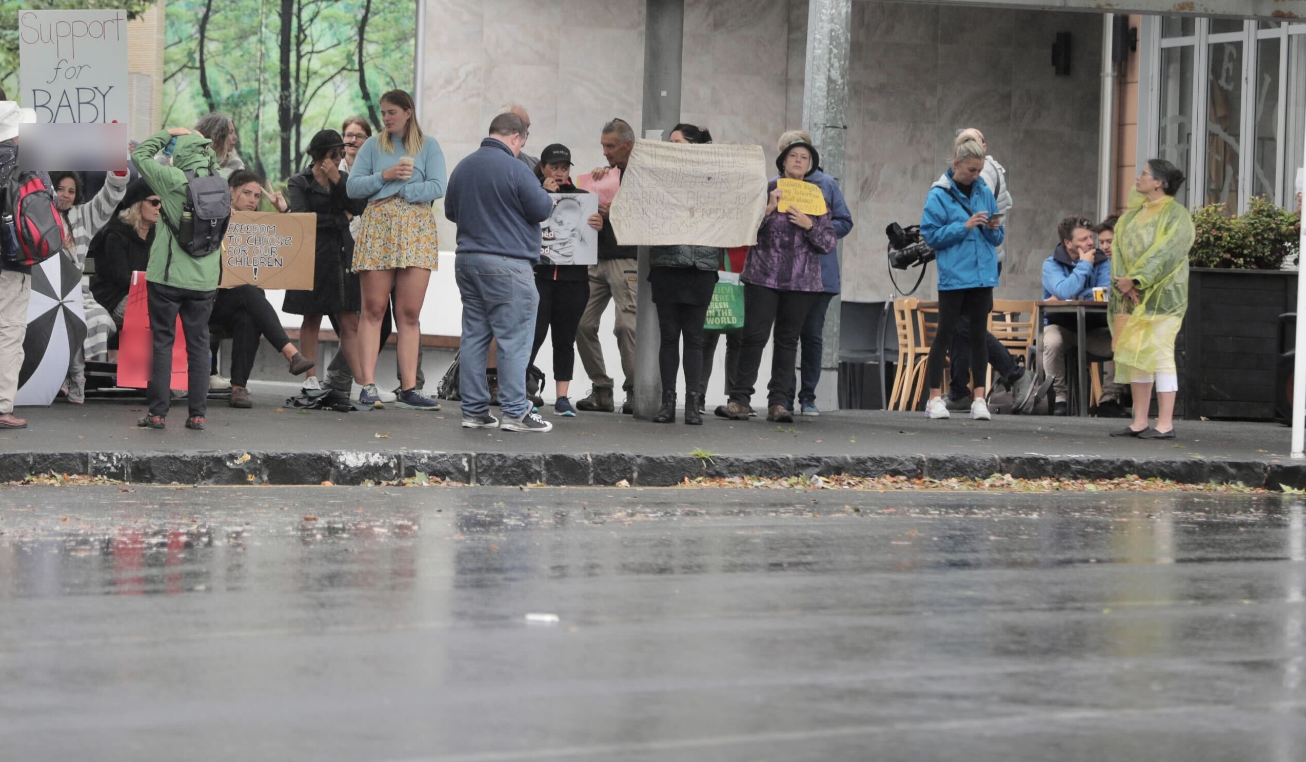 Protesters have started to arrive for the vigil at Auckland City Hospital and the neighbouring Starship, with the baby’s heart surgery planned for today. Photo / Michael Craig