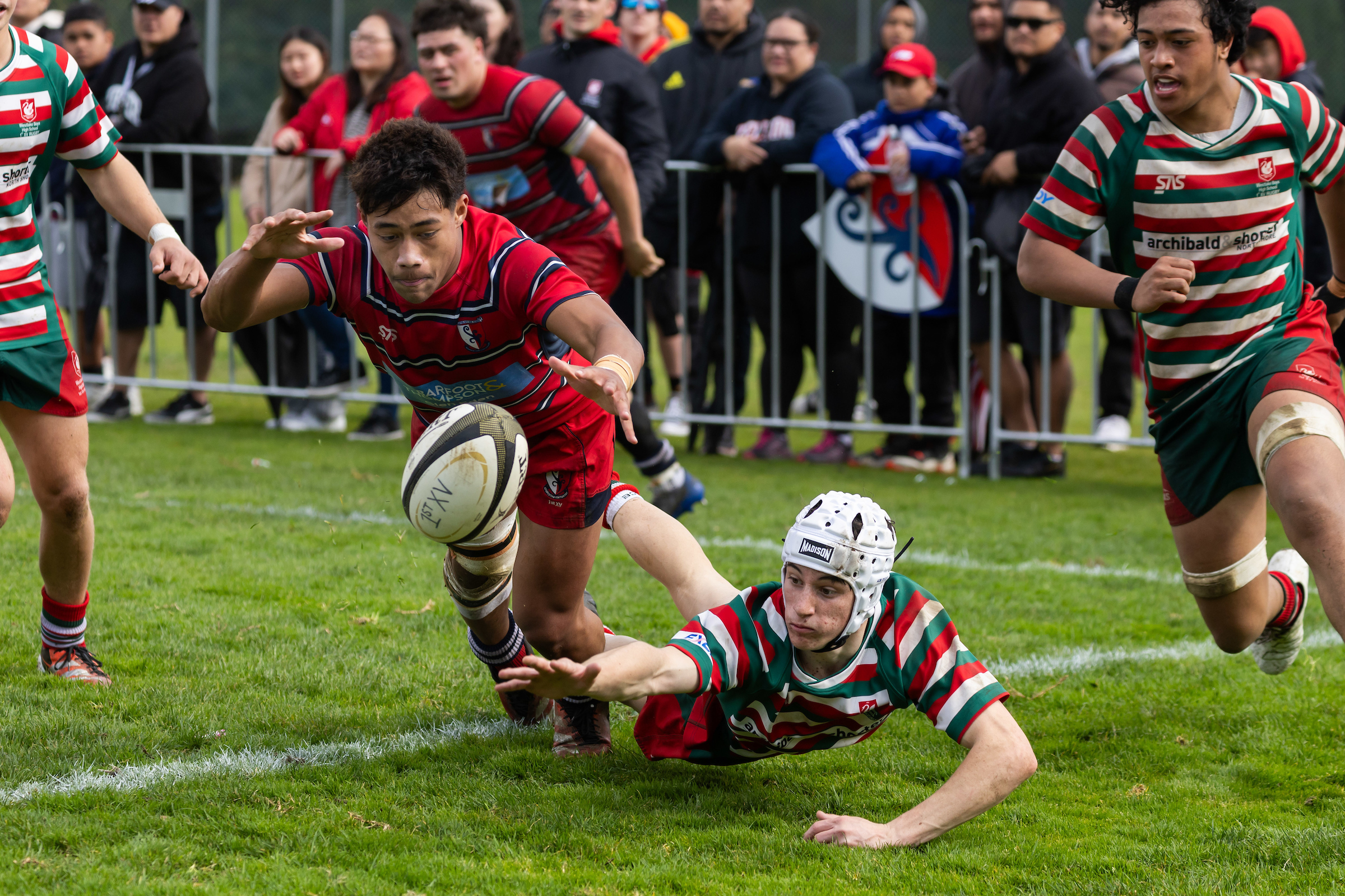 Kelston Boy High School winger Jeremaih Lemana and Westlake Boys High School fullback Brody Good attempt to secure the loose ball during the First XV Blues Final. Photo / Brett Phibbs - Photosport