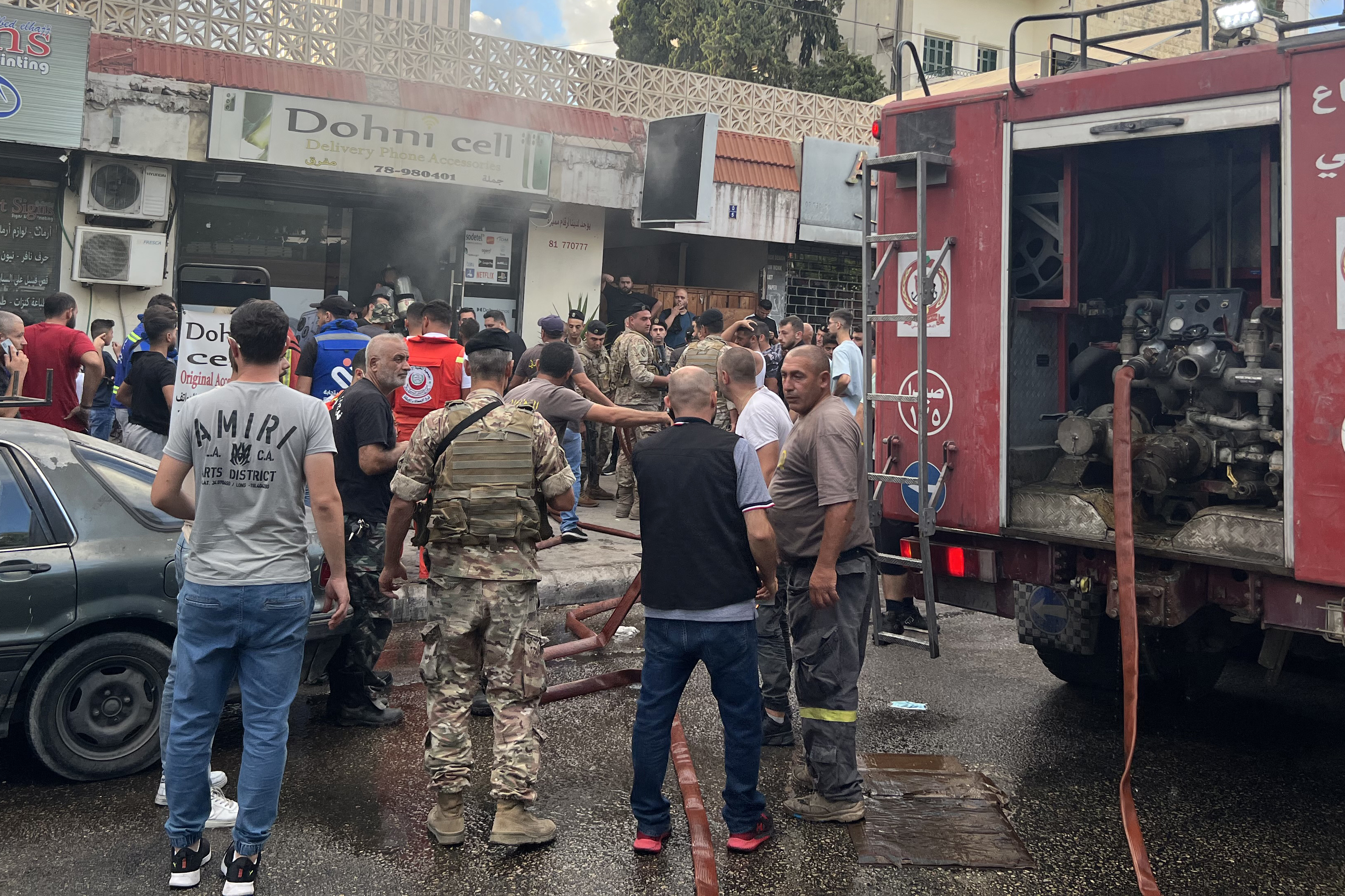 People and first responders gather at the scene of a reported device explosion in Saida in southern Lebanon on Wednesday local time. Photo / AFP