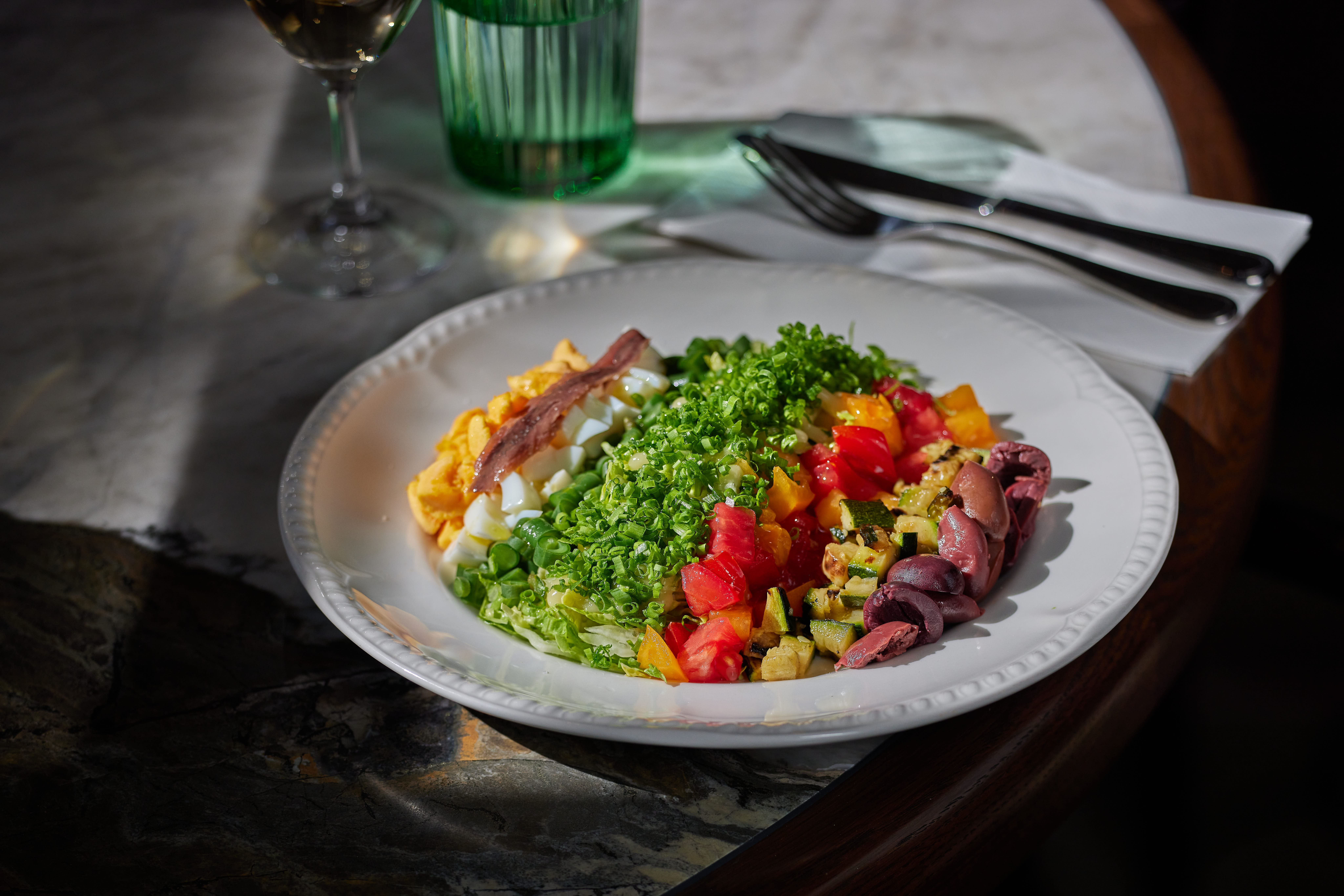 The cobb salad is presented in neat rows, for tossing together with vinaigrette. Photo / Babiche Martens
