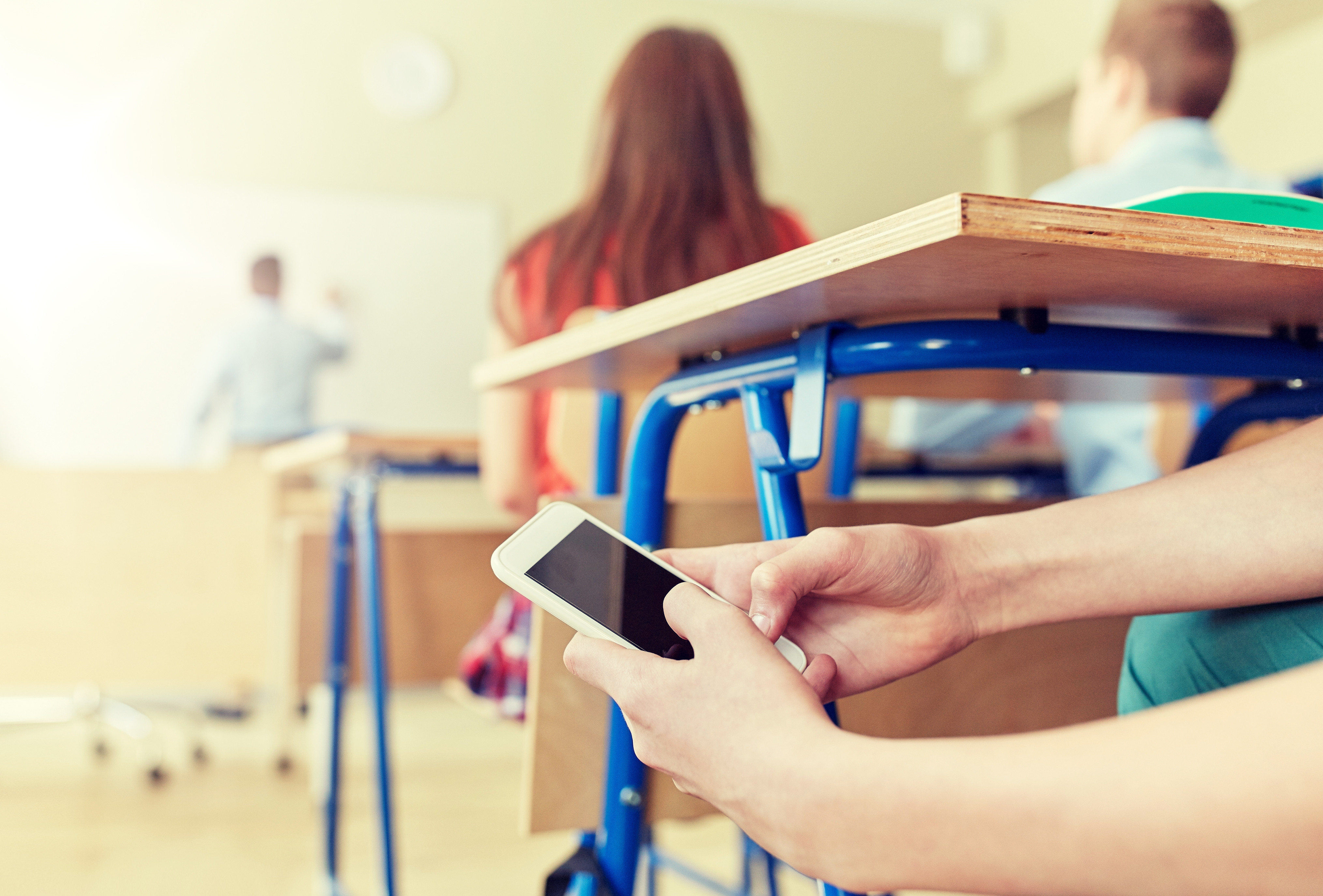 Phones are now banned in New Zealand schools. Photo / 123rf