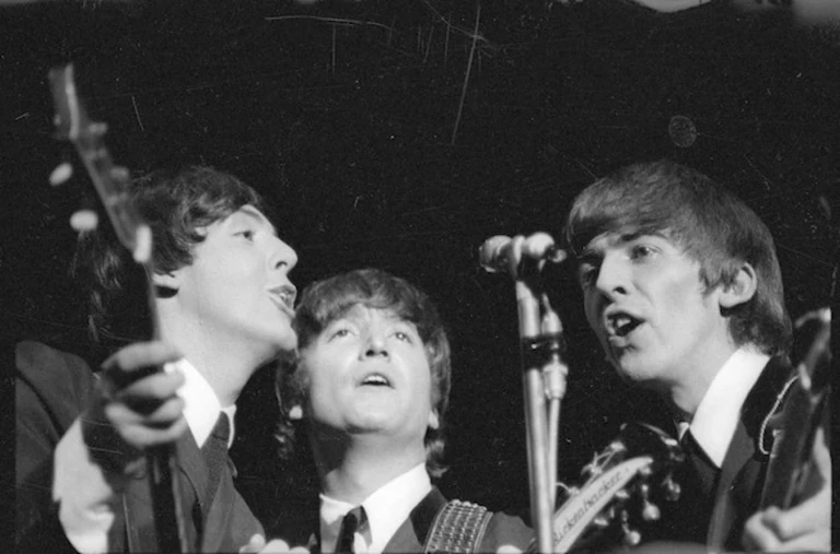 Beatles Paul McCartney, John Lennon and George Harrison singing during their Wellington concert. Photo / Dominion Post, Alexander Turnbull Library, Wellington