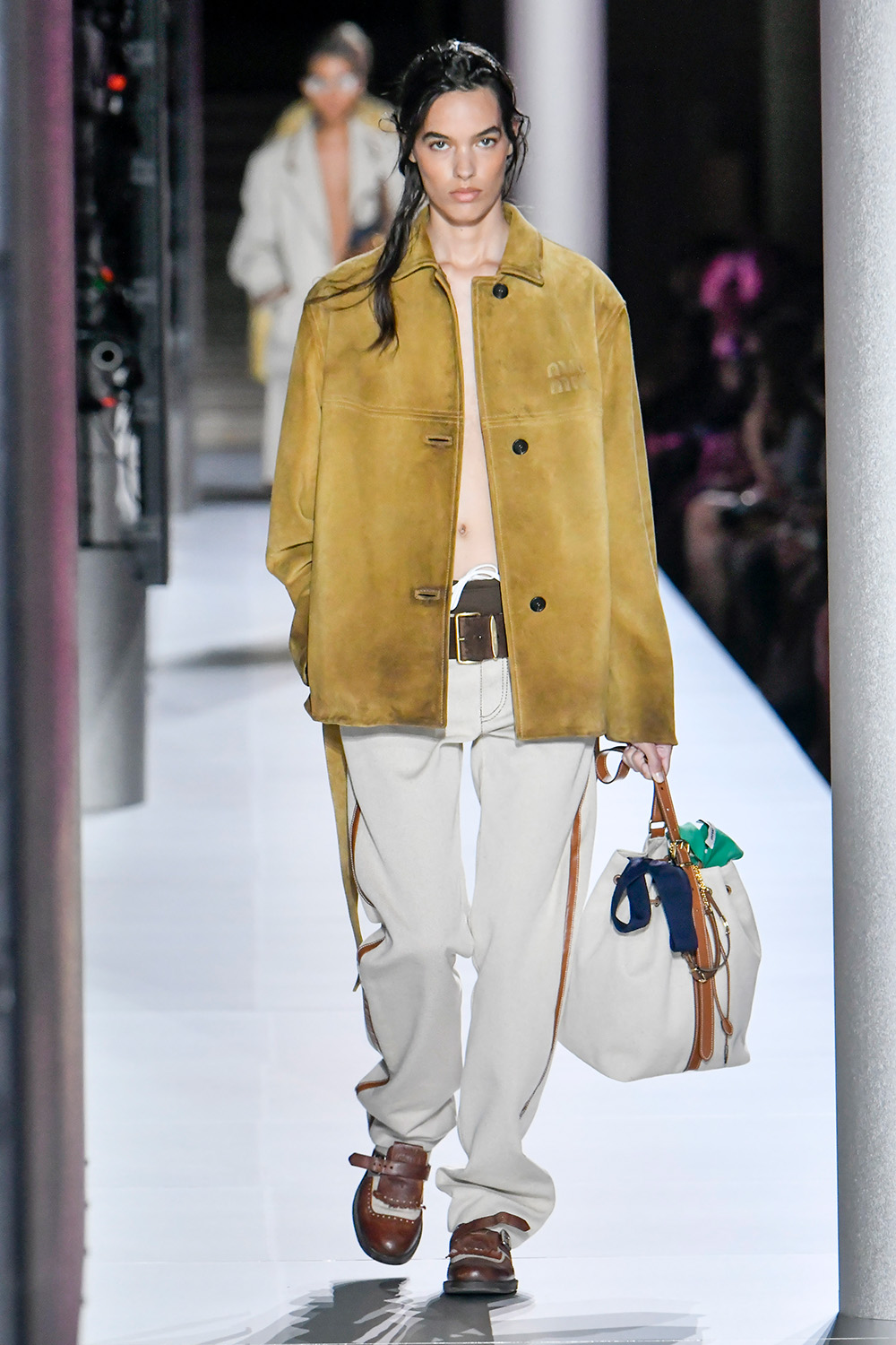 A model walks the runway during the Miu Miu Ready to Wear Spring/Summer 2024, messy bag in tow. Photo / Getty Images