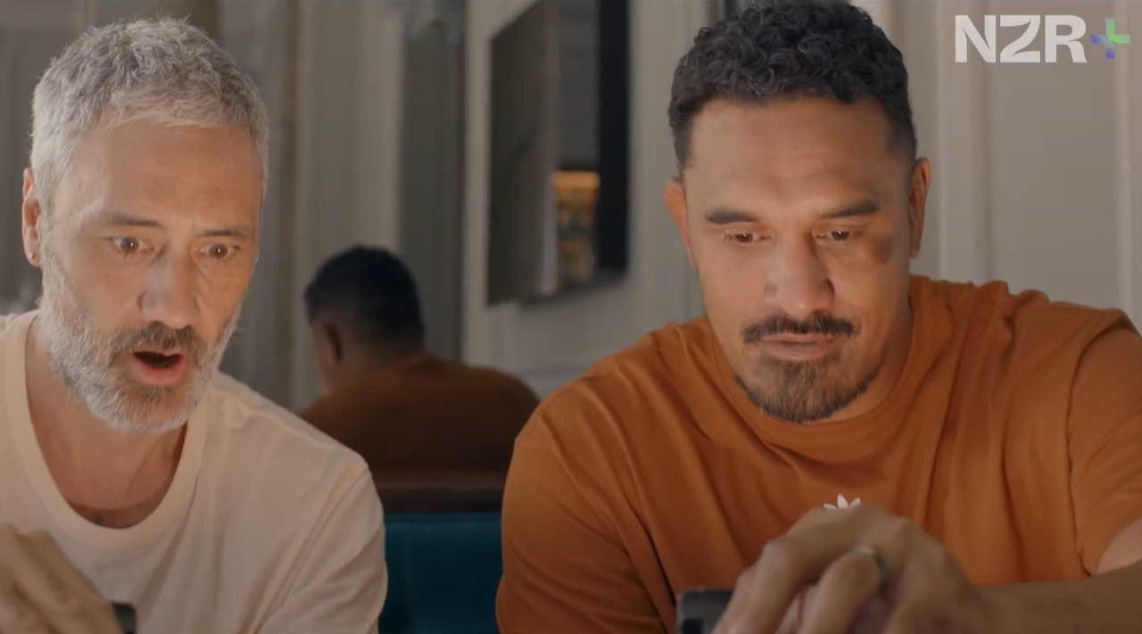 Kiwi director Taika Waititi with All Blacks great Jerome Kaino in a clip from the NZR+ show Tour de Rugby. Photo / NZR+