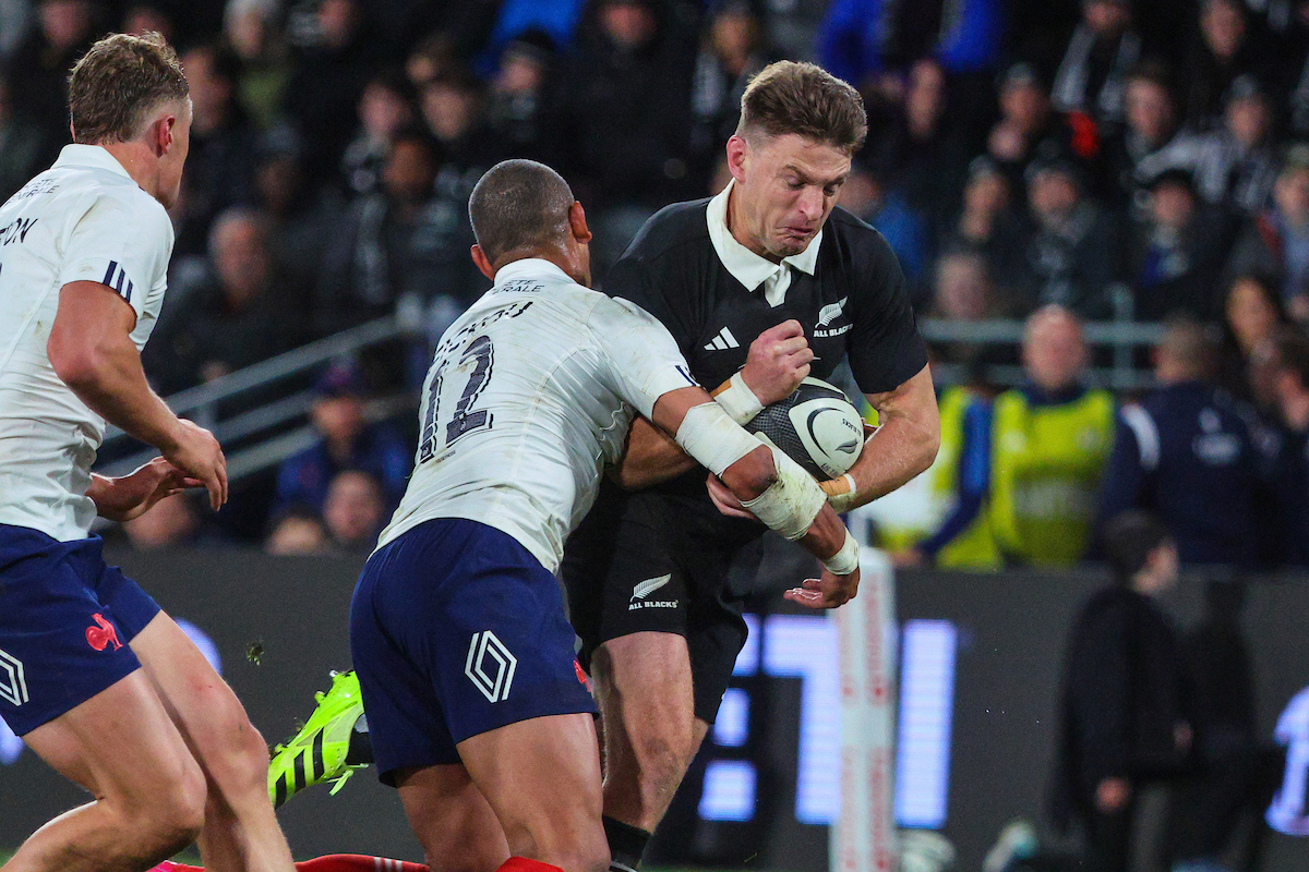 Beauden Barrett is tackled by French captain Gaël Fickou in Dunedin. Photo / Photosport