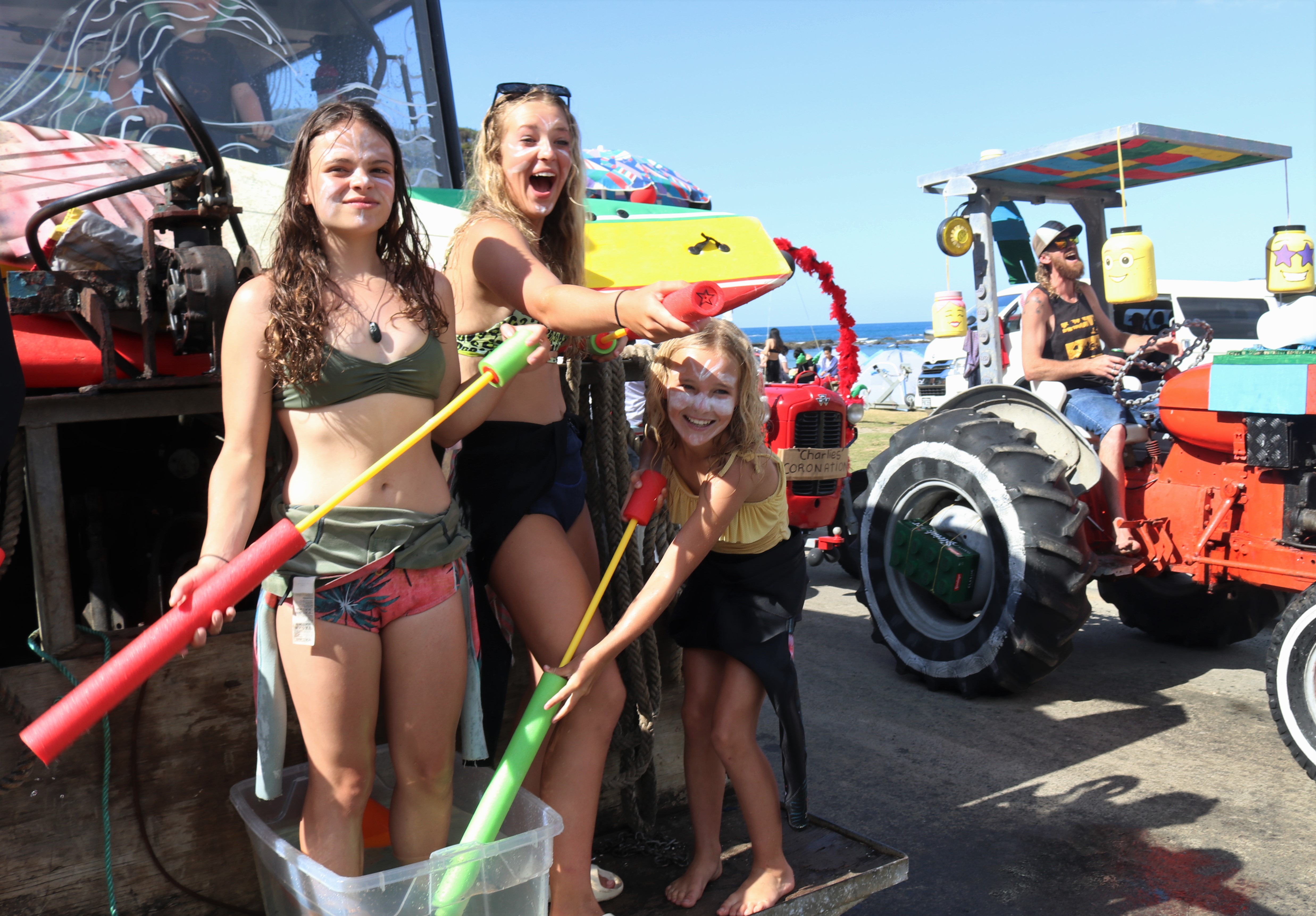 The crew from Bob’s Surf School made sure no-one went home dry. Photo / Peter de Graaf