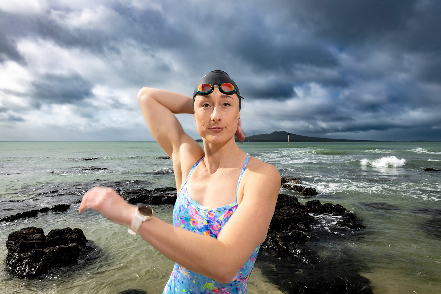 Laura Quilter warms up at Takapuna Beach, one of her favourite spots for ocean swimming. Photo / Michael Craig