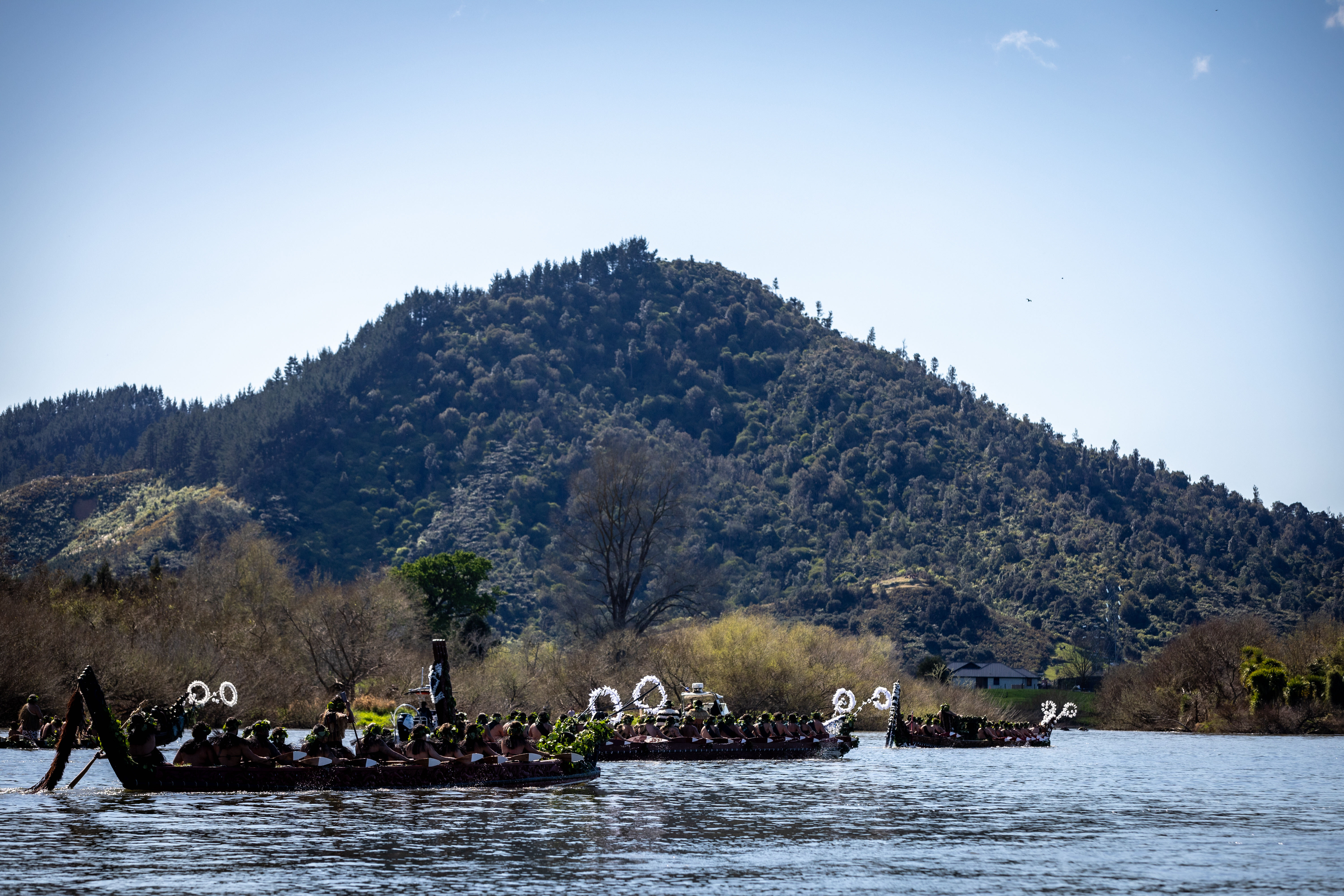 The Māori Queen travelled from Tūrangawaewae with her father’s casket by waka down the Waikato River to the base of Taupiri Maunga. Photo / Michael Craig